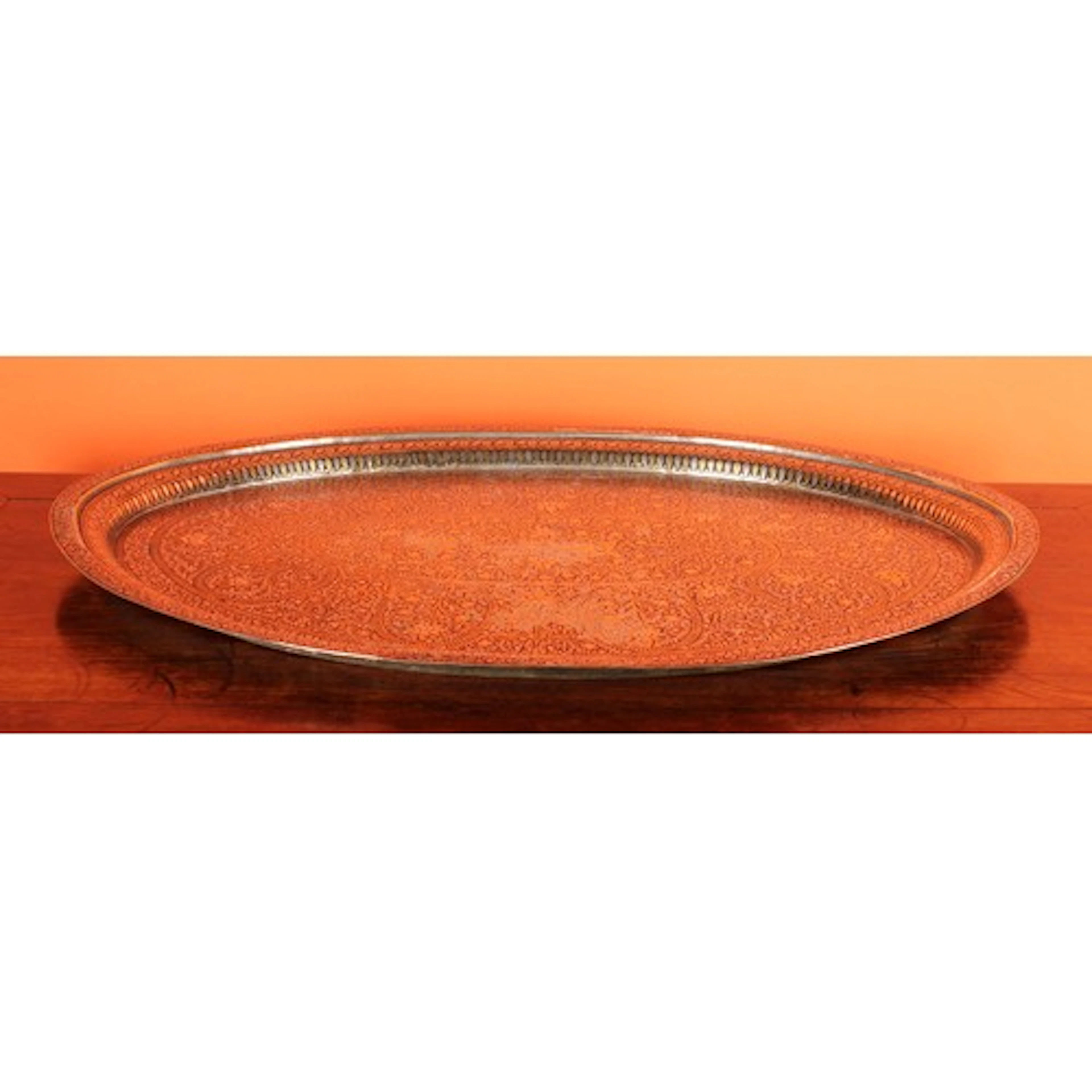 A large Indian bidri oval tray, profusely decorated with lot...