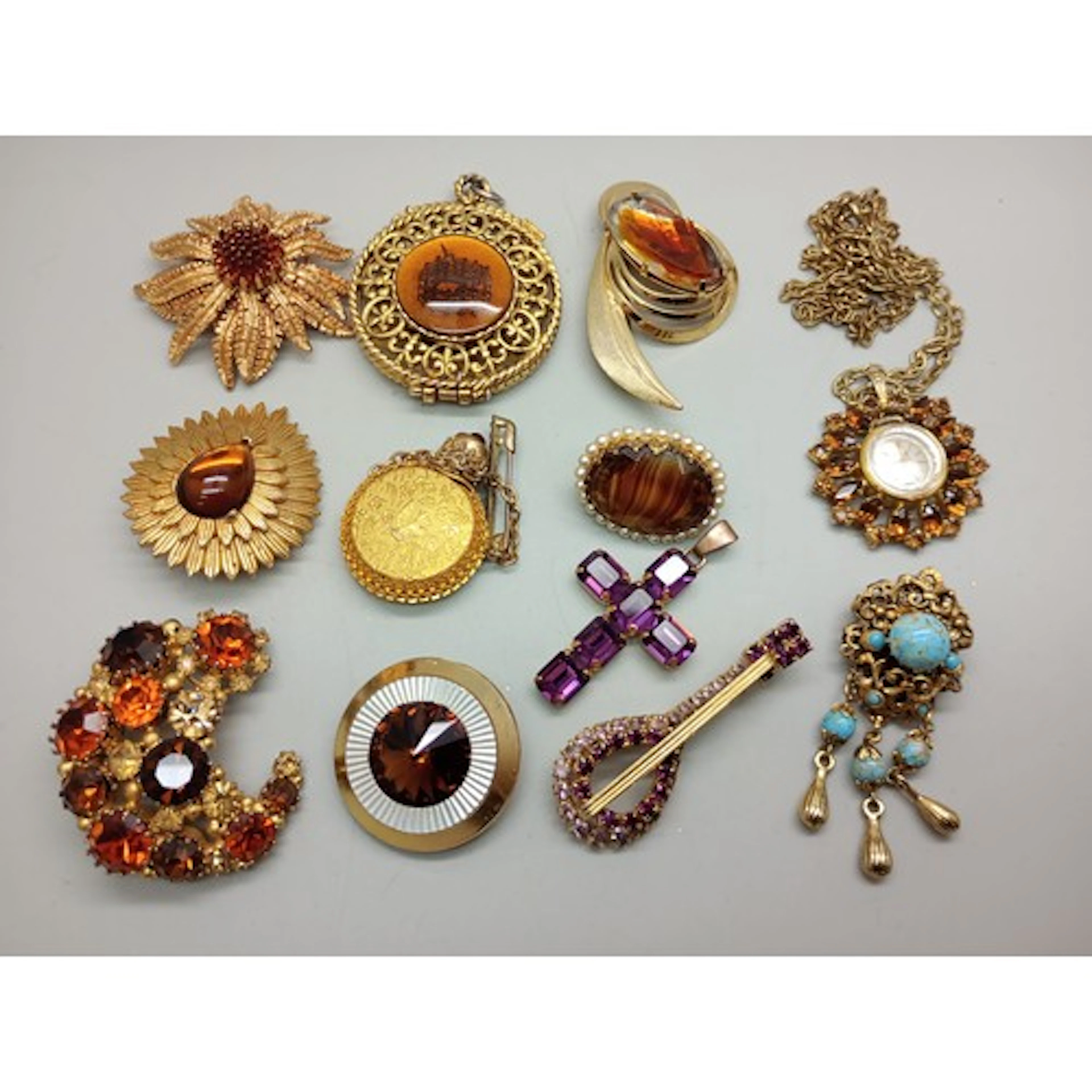 A collection of vintage gold tone costume jewellery includin...