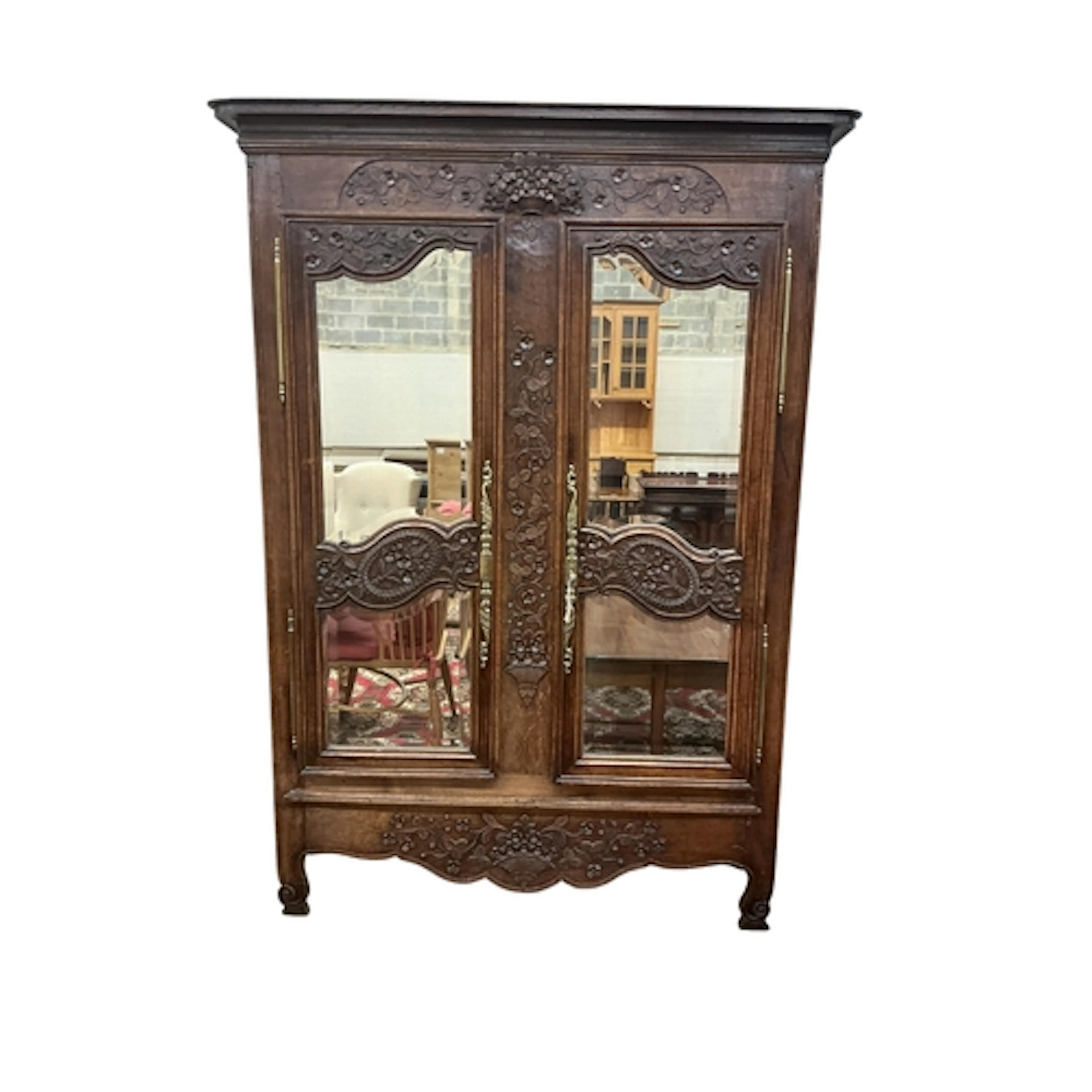 An 18th century Normandy carved oak armoire with later bevel...