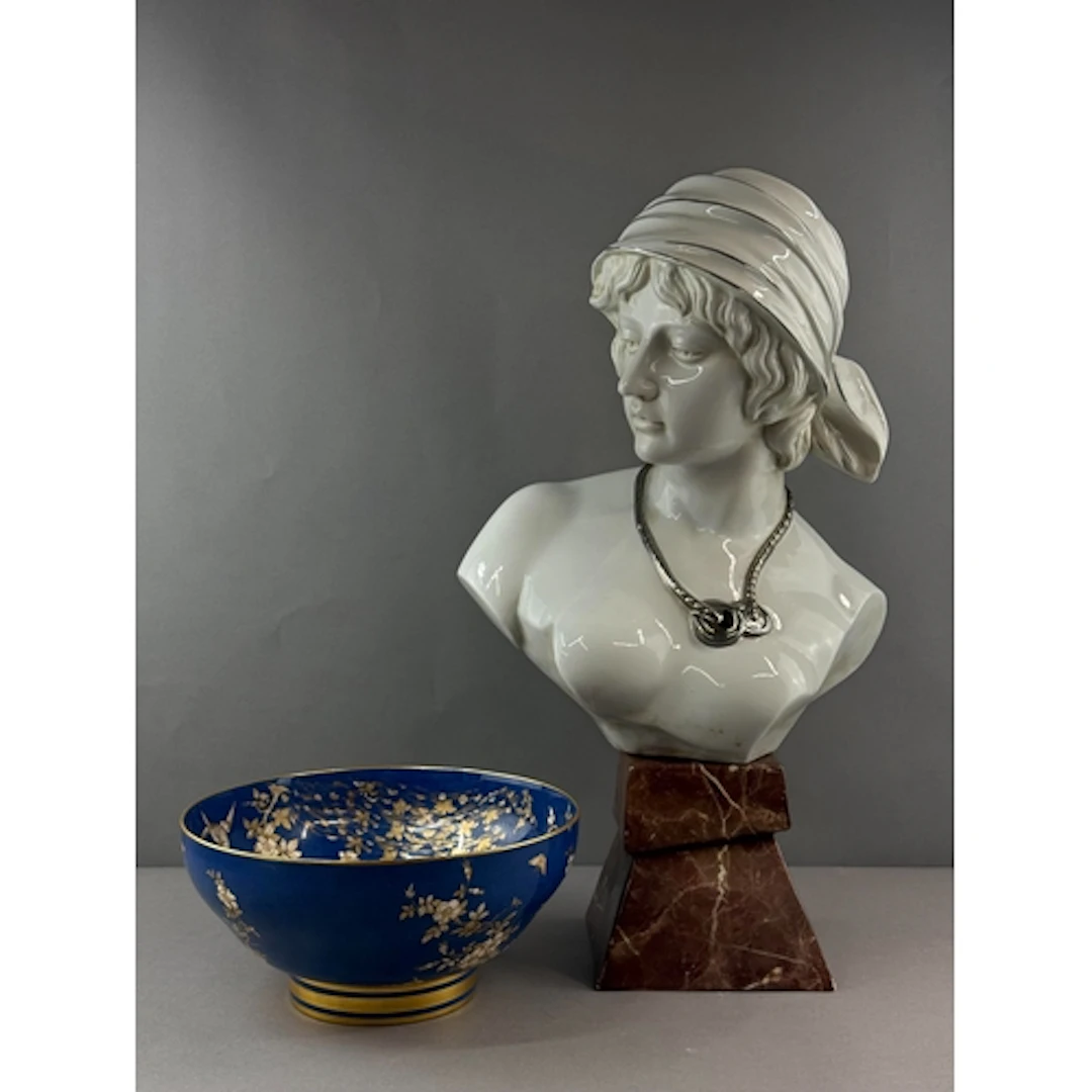 Ceramics: a topless bust of a maiden, 20th century, depicted...