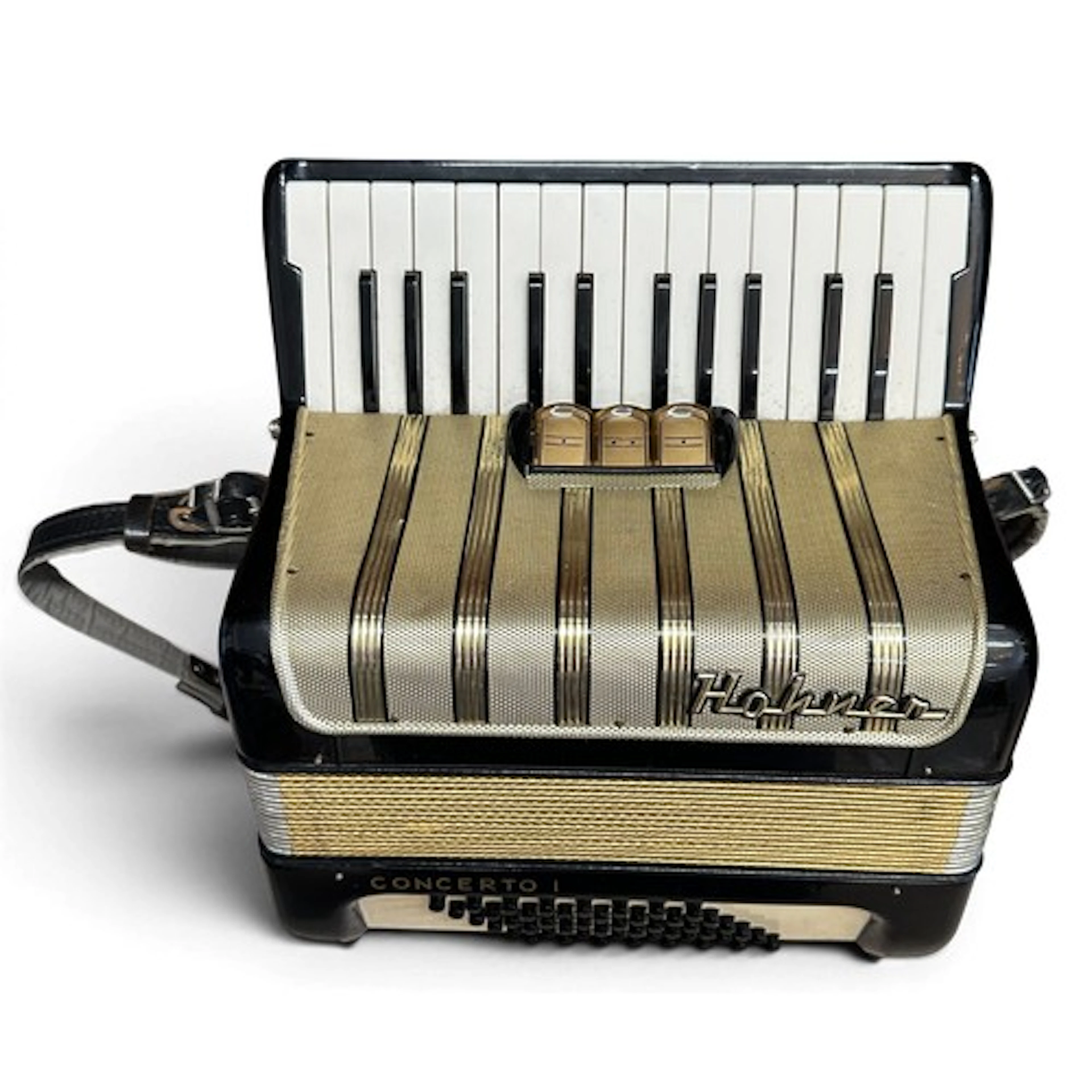 A cased Hohner Concerto 1 accordion in gold and black.