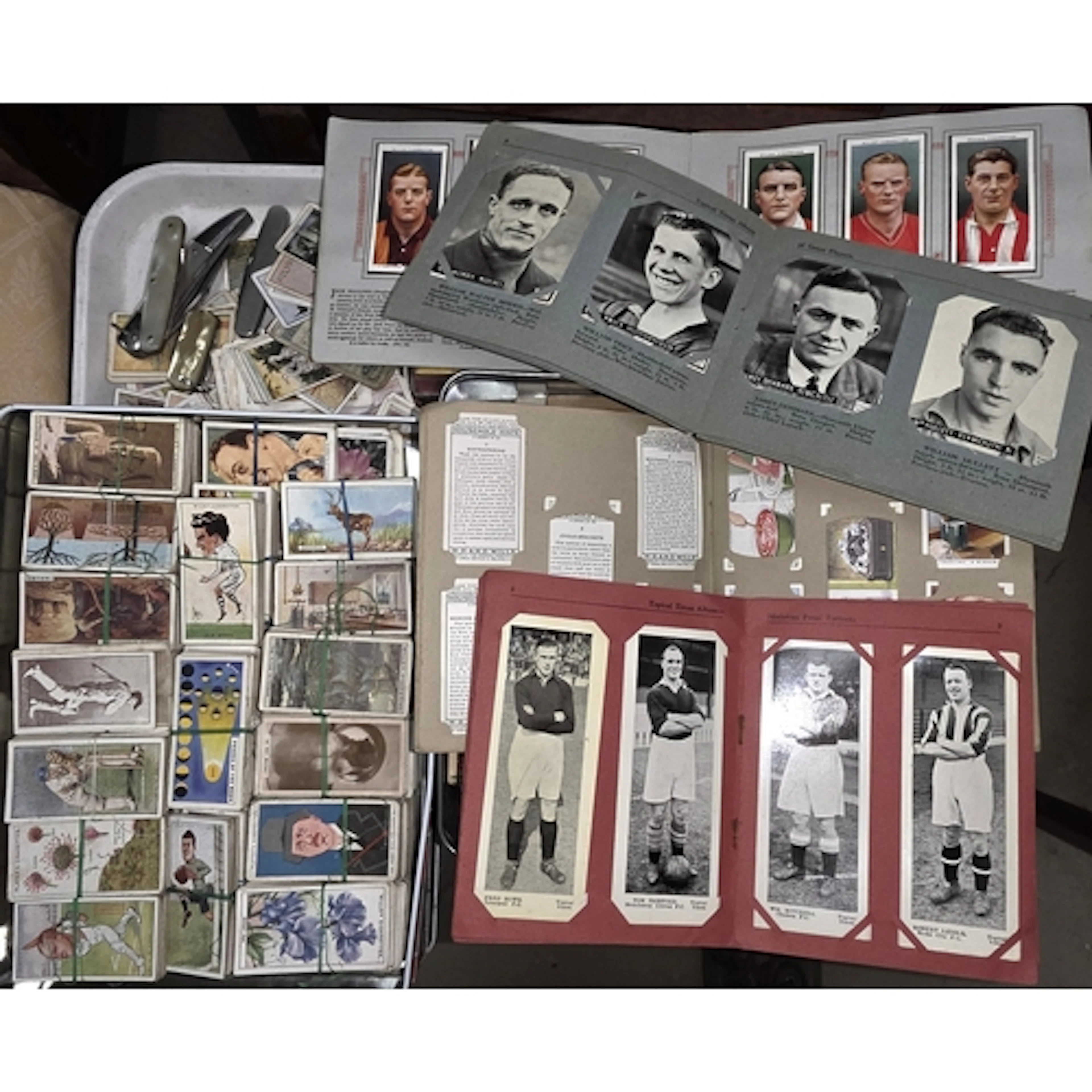 A large collection of Cigarette and other cards, pocket kniv...