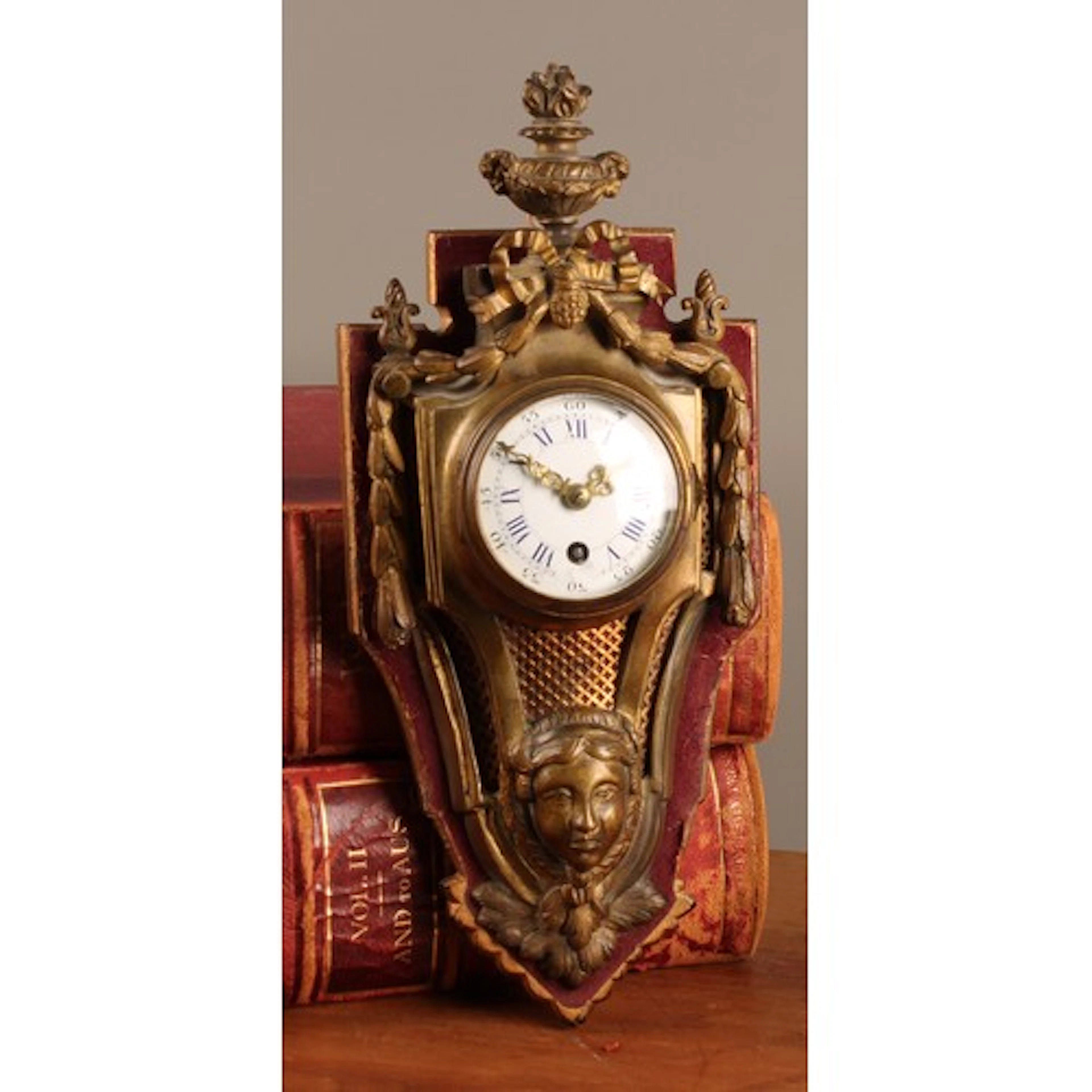A 19th Century gilt bronze cartel time piece, 6.5cm enamel c...