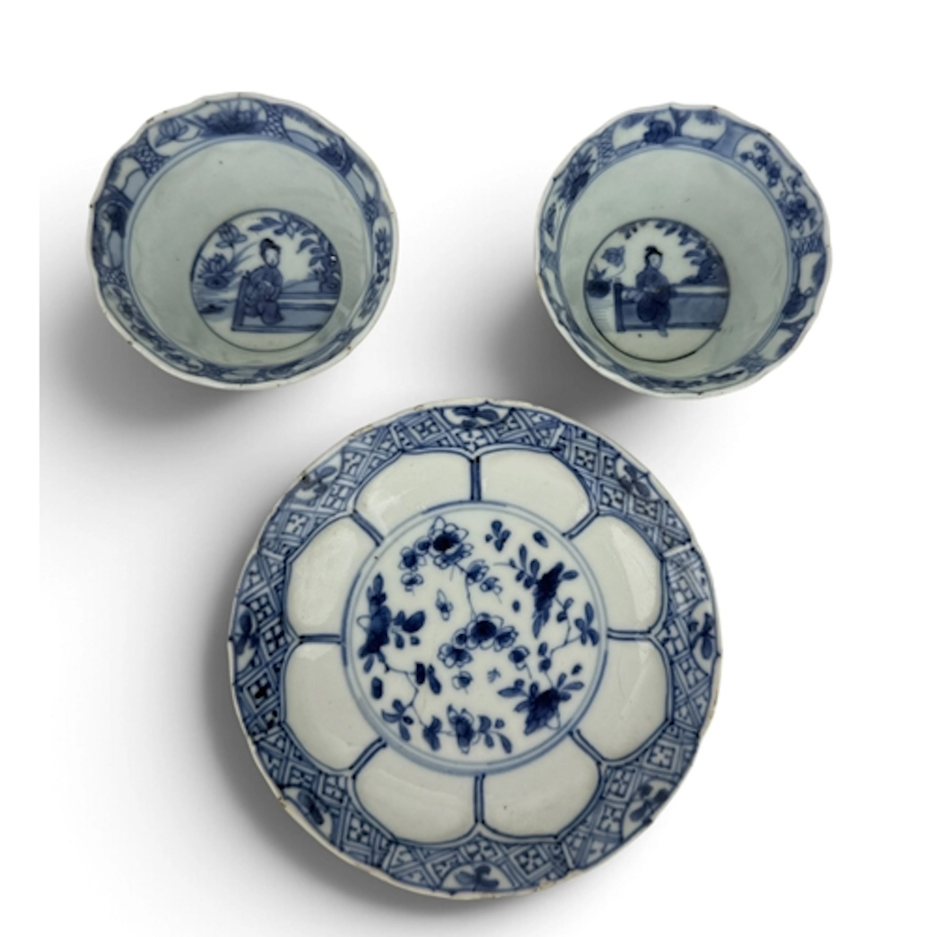 A PAIR OF CHINESE BLUE AND WHITE PORCELAIN TEA BOWLS AND SAU...