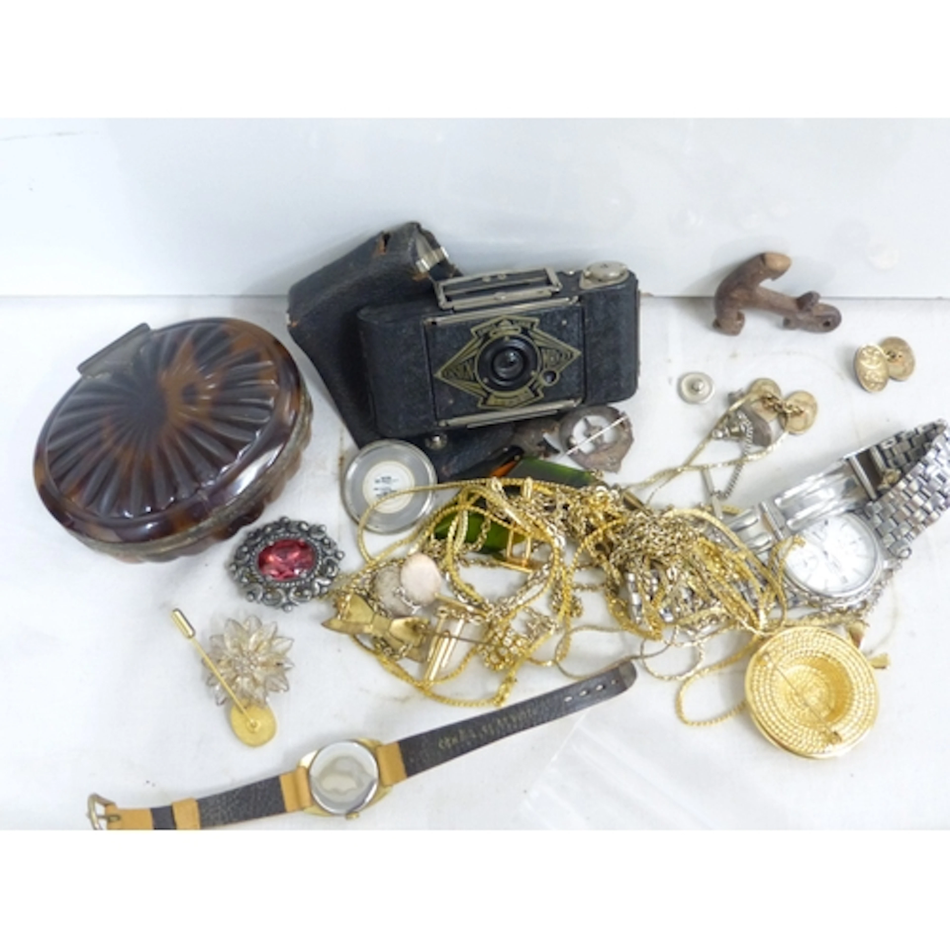 Bag of vintage costume jewellery and a camera.