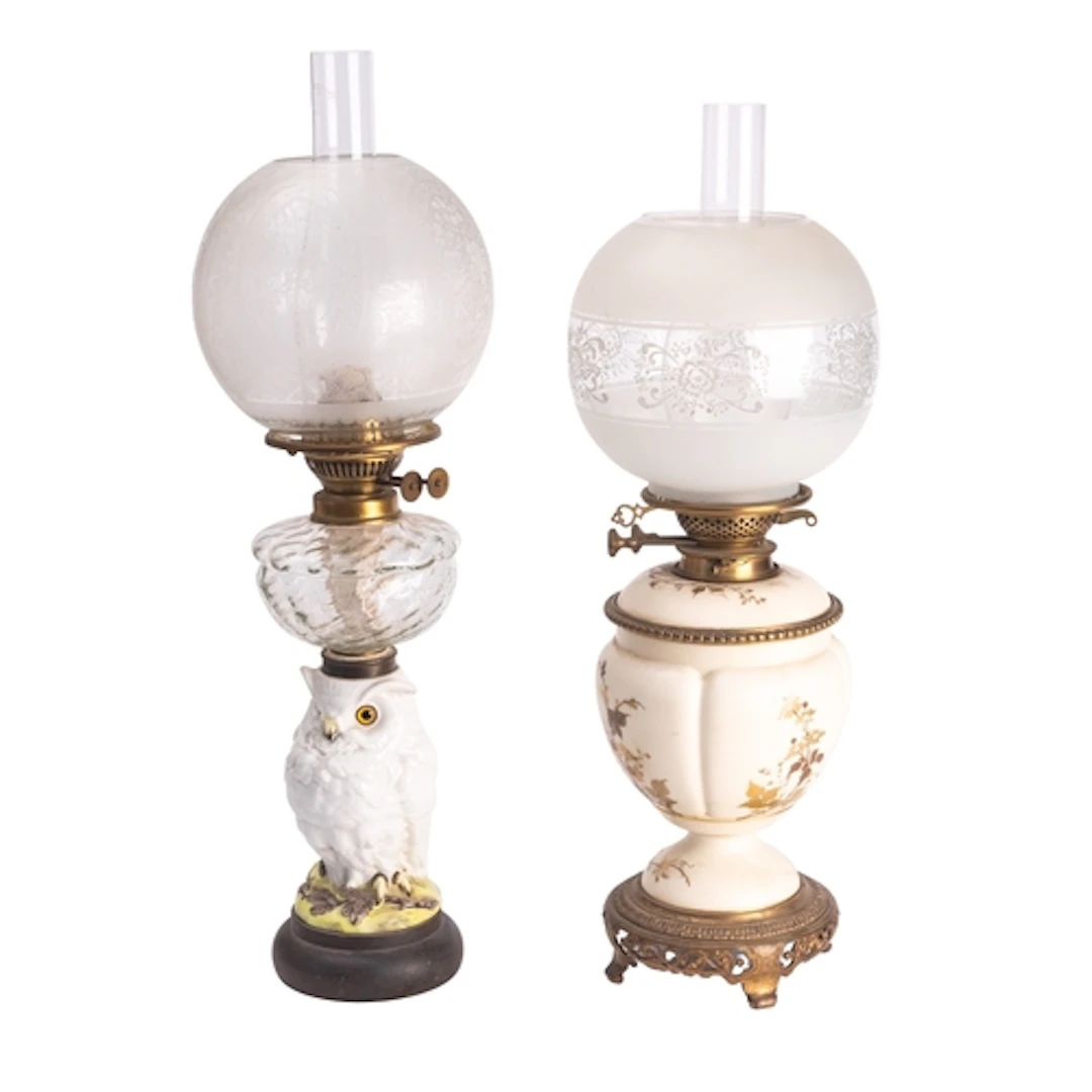 A French porcelain table oil lamp, the stem in the form of a...