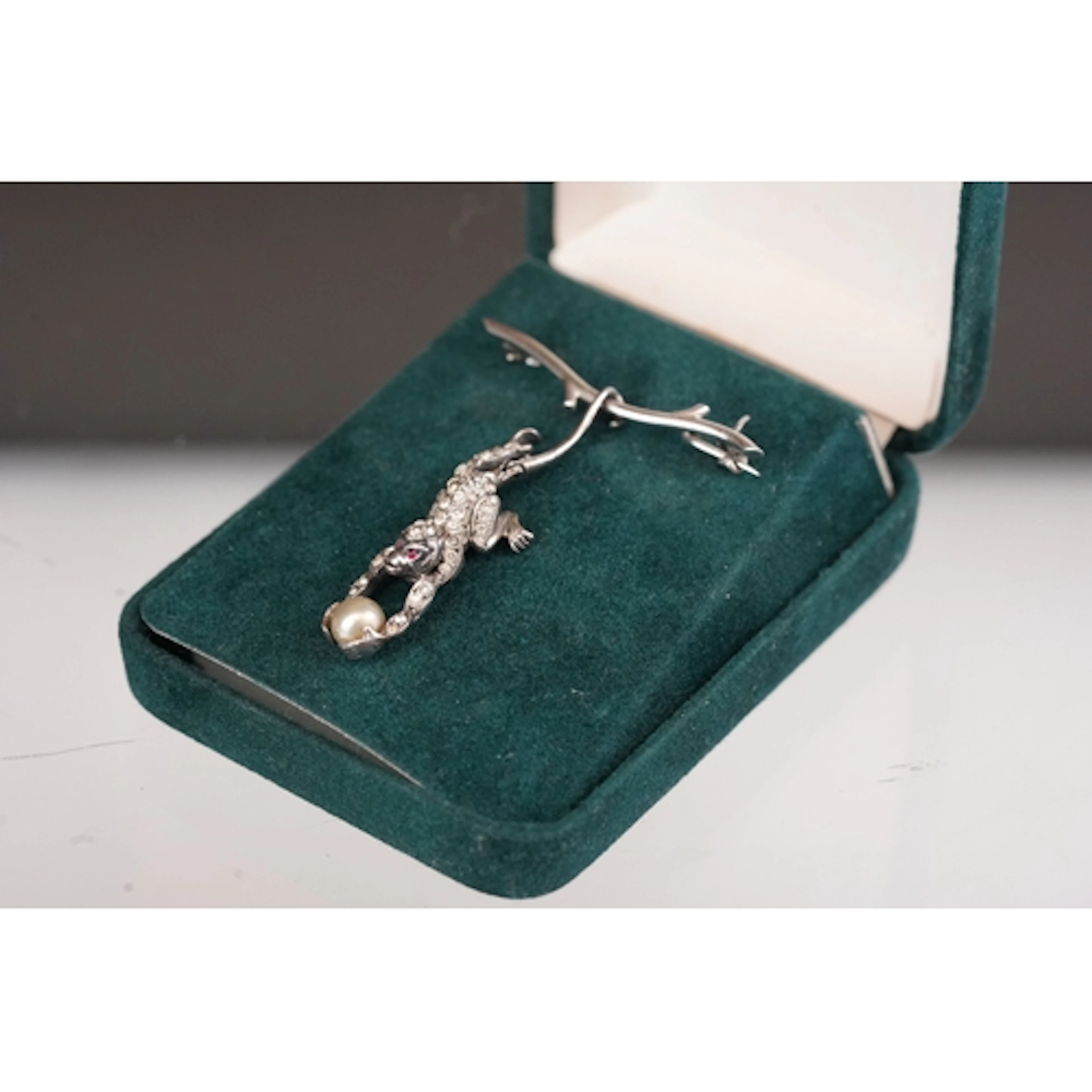 An Art Deco Knoll & Pregizer silver brooch depicting a monke...