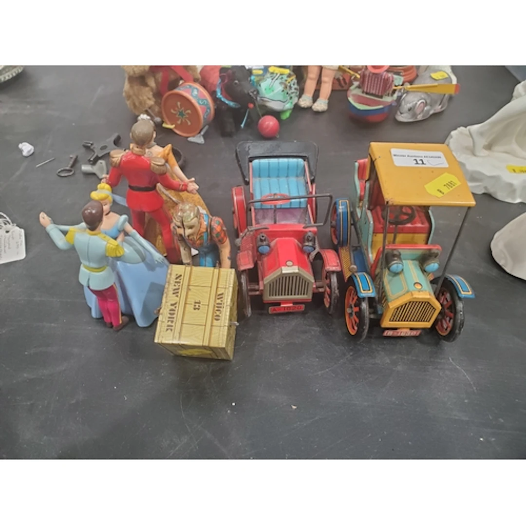 Two Japanese tinplate Cars, German clockwork man moving a pa...