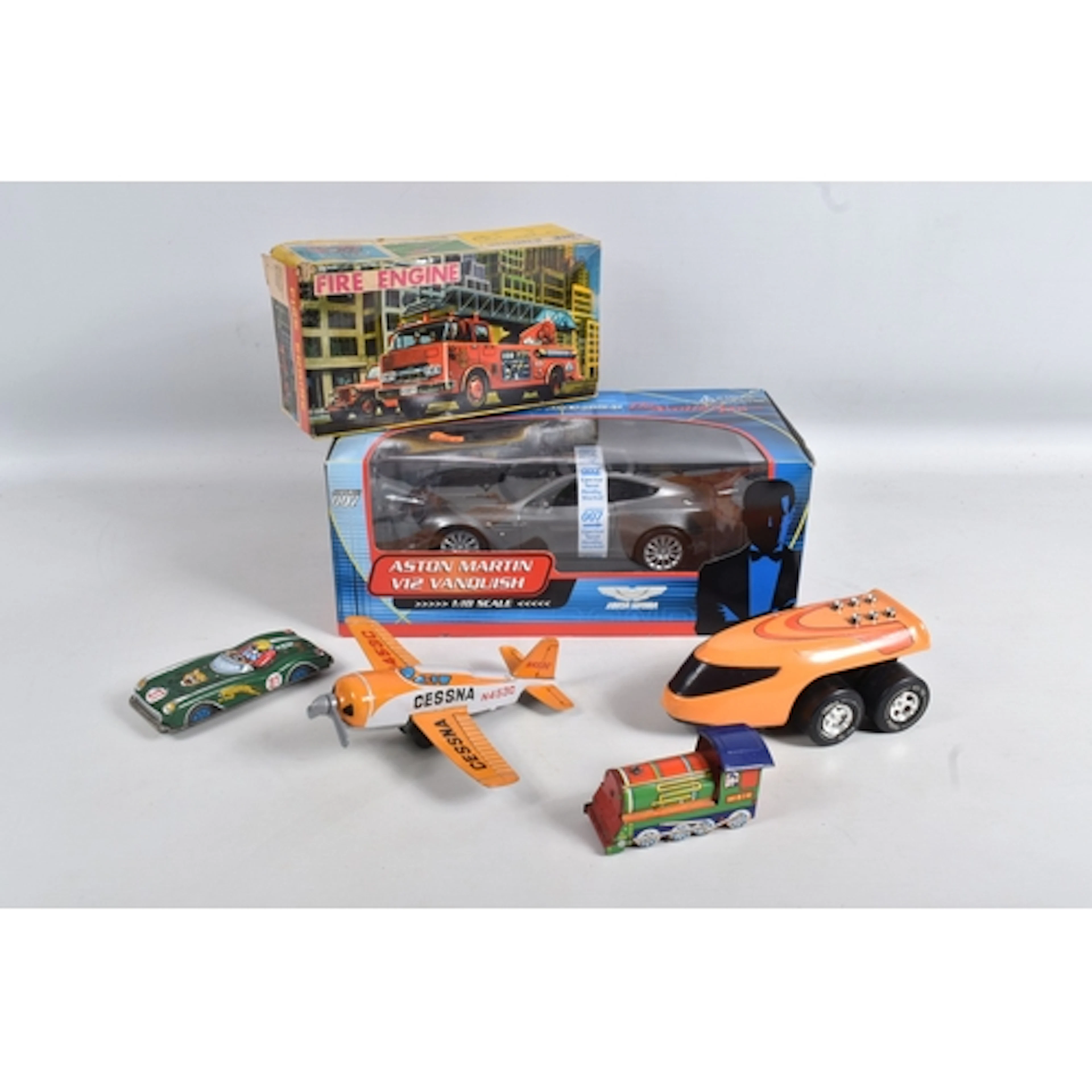 A BOXED JAMES BOND VEHICLE AND A QUANTITY OF TIN PLATE MODEL...