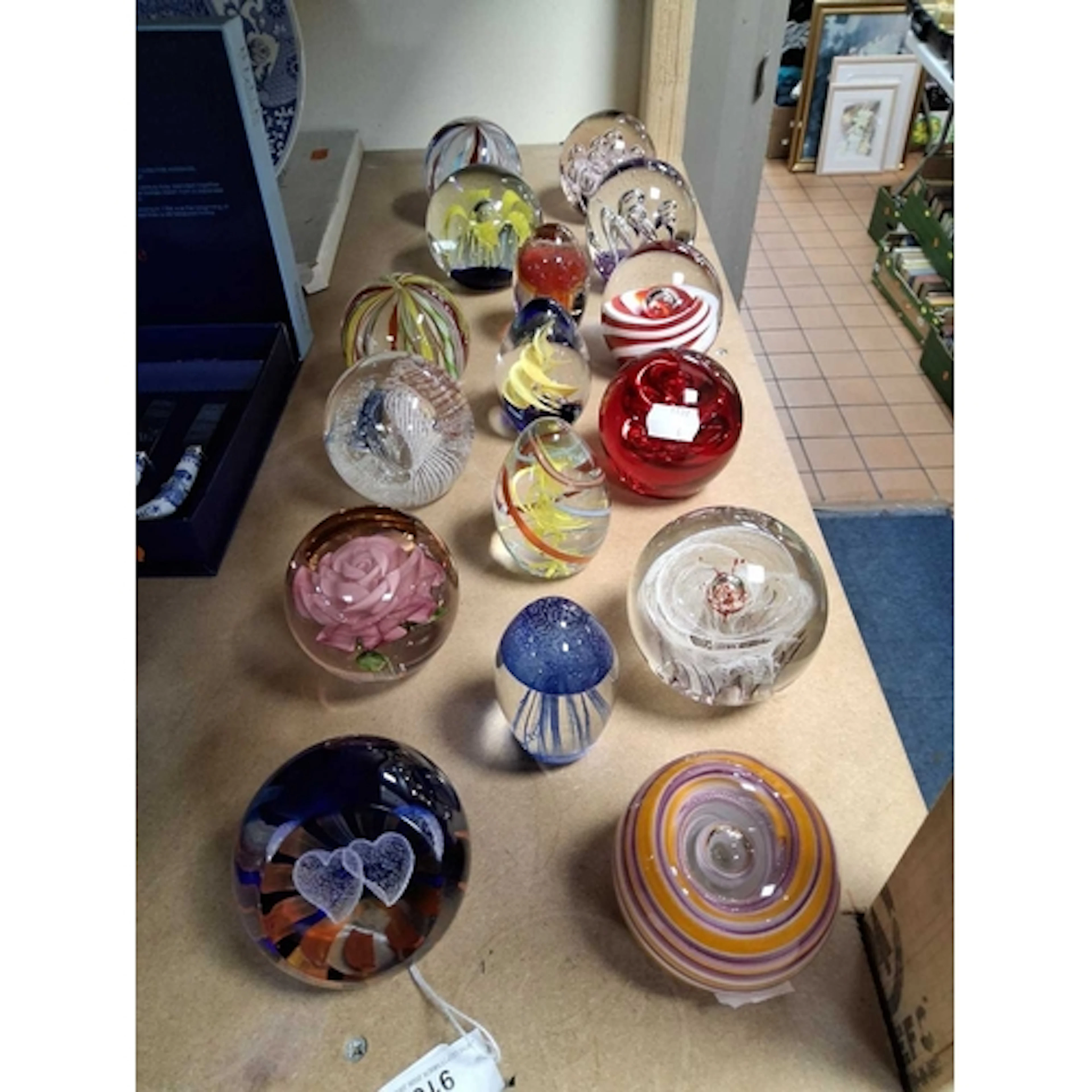 A SMALL COLLECTION OF SIXTEEN GLASS PAPERWEIGHTS to include ...