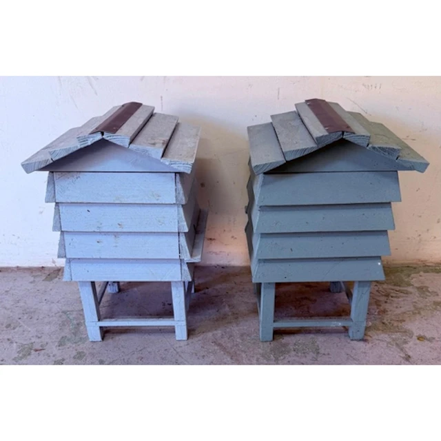 Two *wooden beehive style garden storage boxes. Height 41cm...