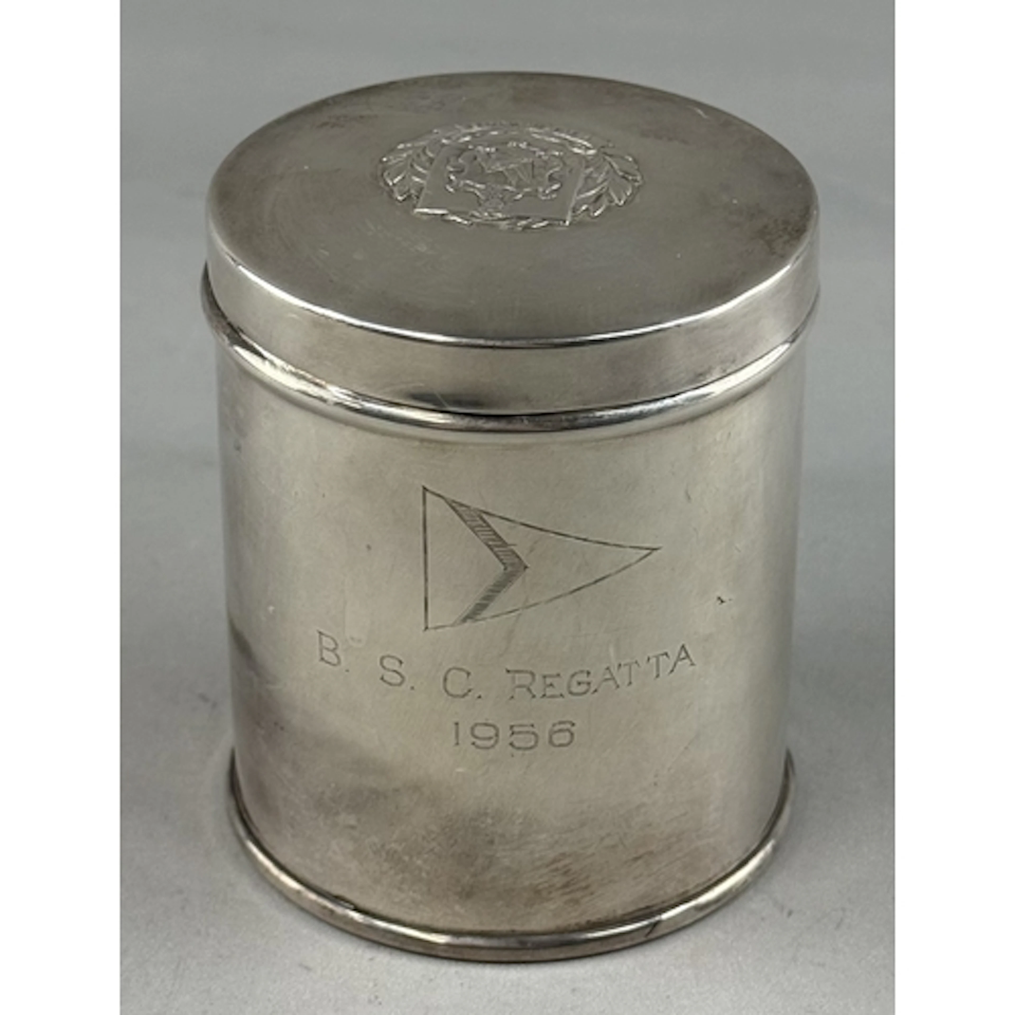Hallmarked Silver: cigarette canister the lid having the cre...