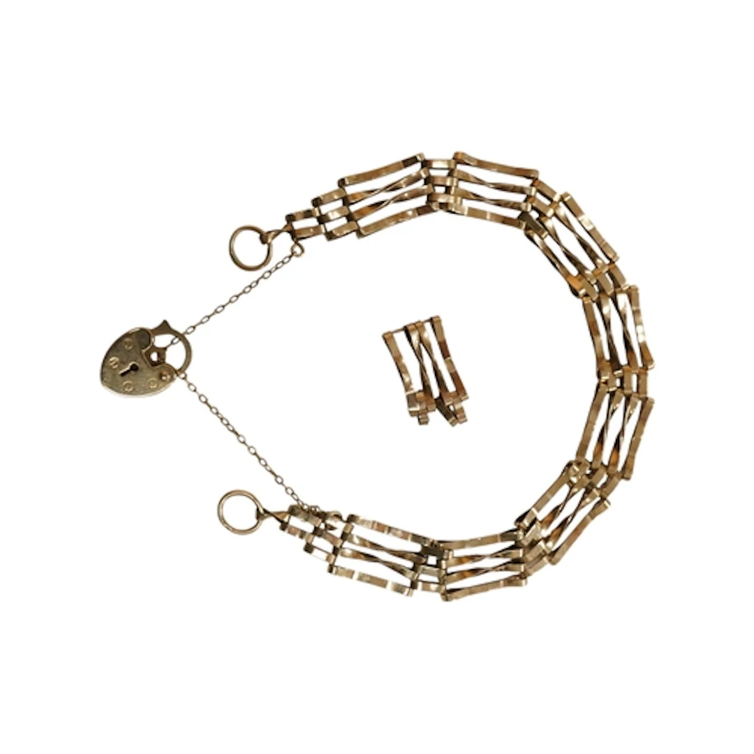 A late 20th century 9ct gold gate link bracelet, with spare ...