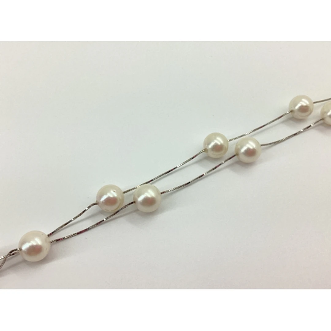 A Decorative Pearl Bead Necklace, the cream pearl beads betw...