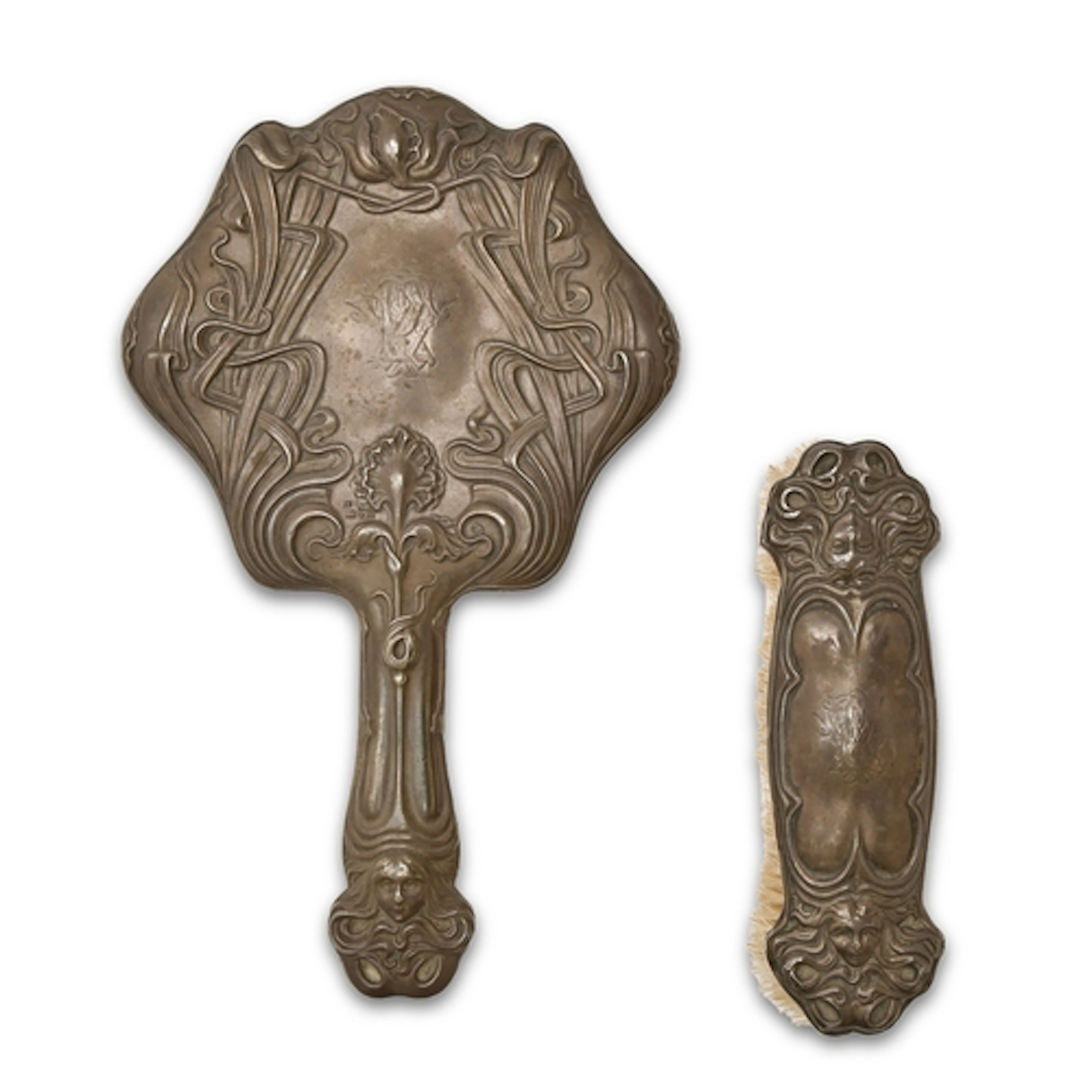 An Edwardian Art Nouveau silver hand mirror and brush, by C ...