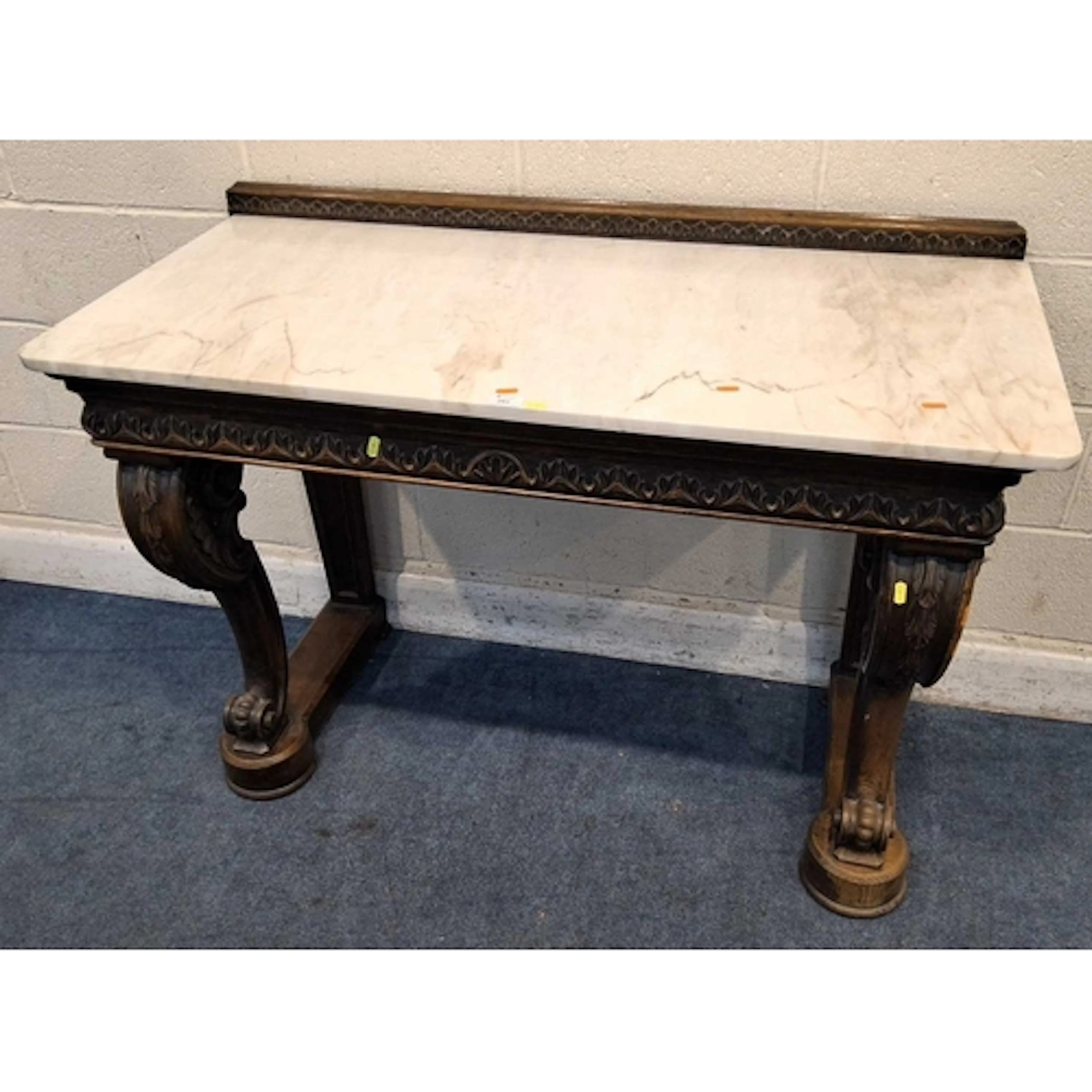 AN OAK FRAMED MARBLE TOP CONSOLE TABLE, with a ledge back, r...