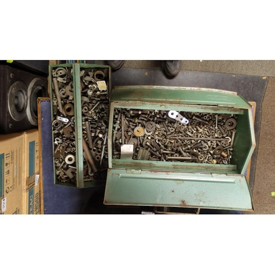 A collection of metal toolboxes and socket sets, including a...