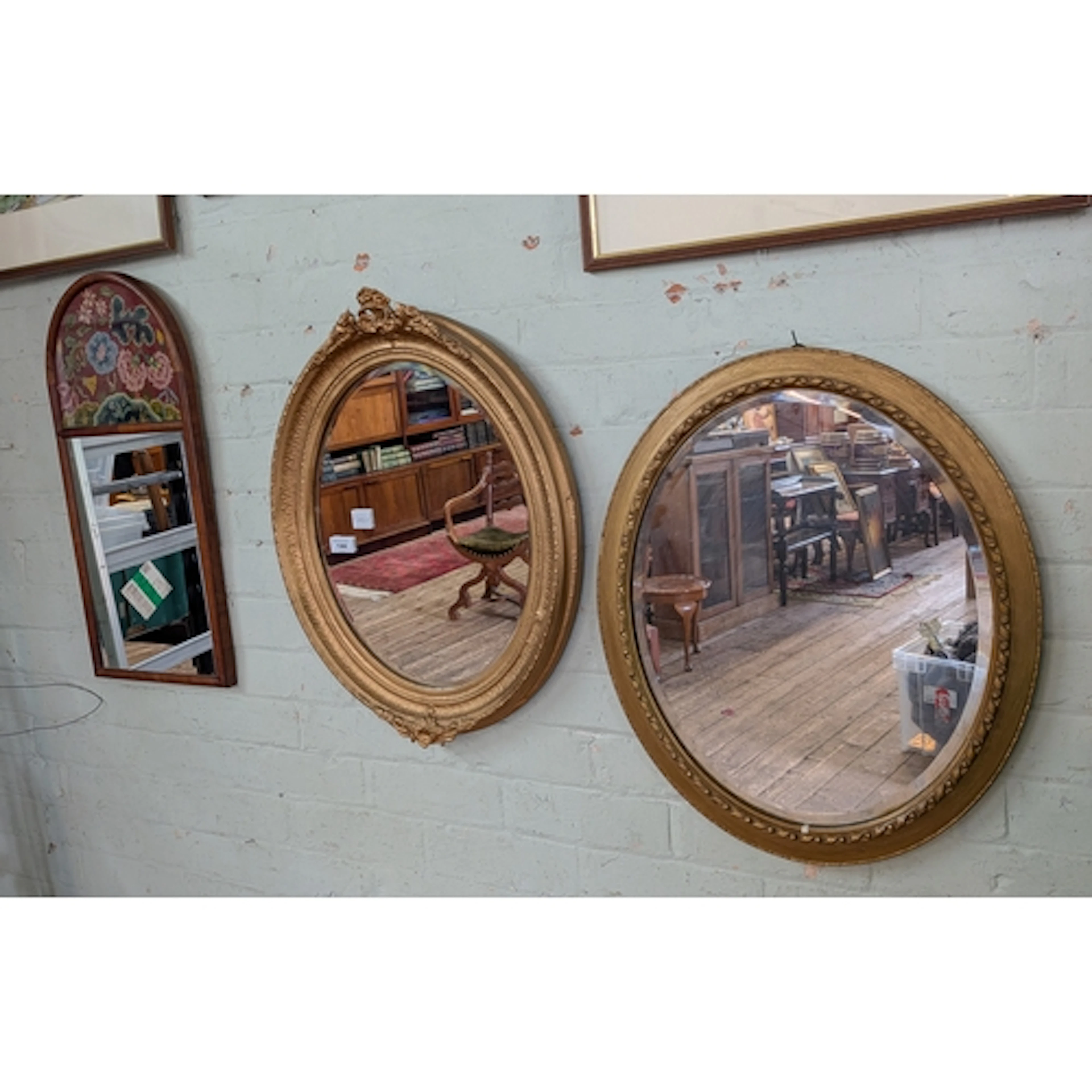 Two Victorian style gilt framed mirrors and another in mahog...