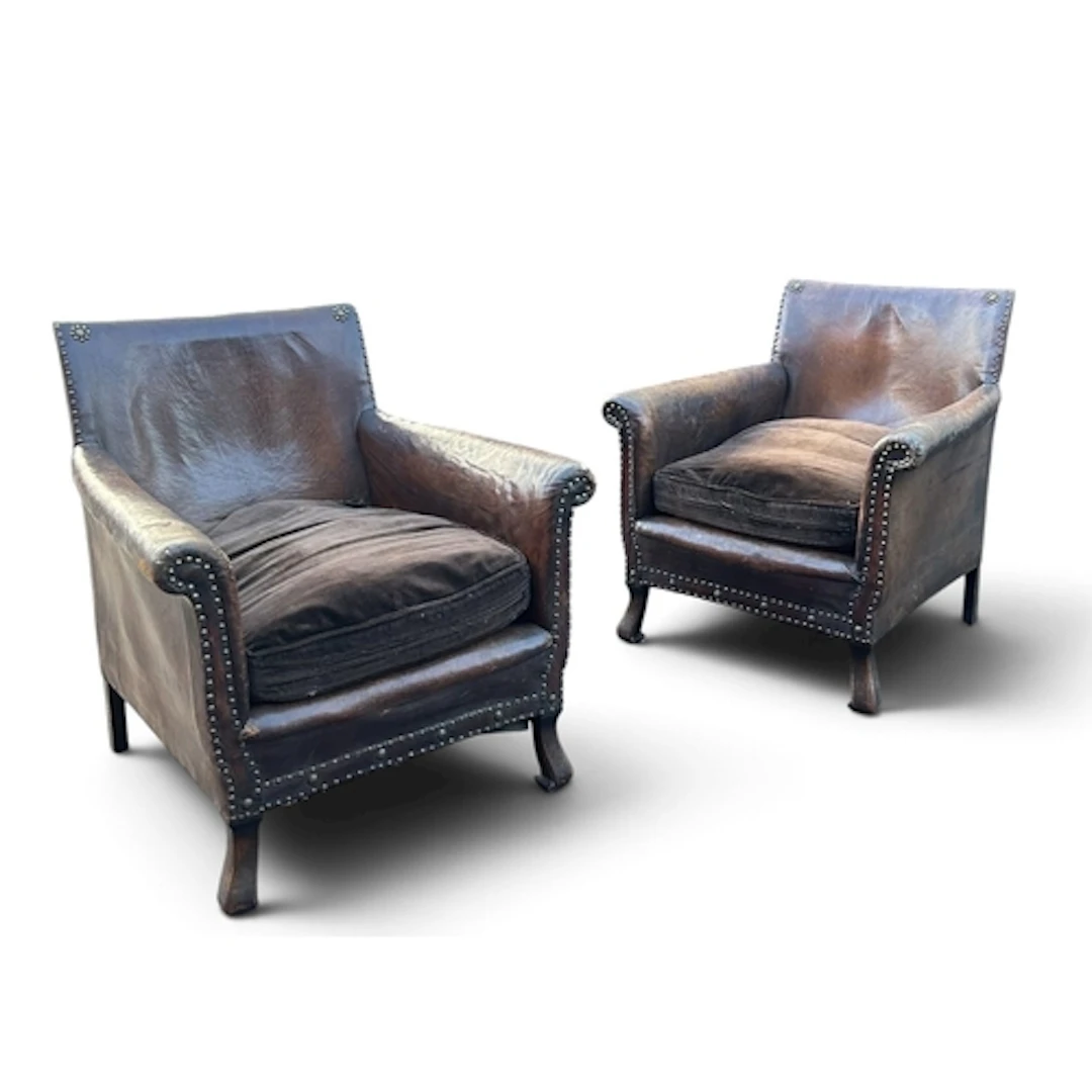 A PAIR OF 1930S SWEDISH LEATHER ARMCHAIRS WITH BRASS BEAD DE...