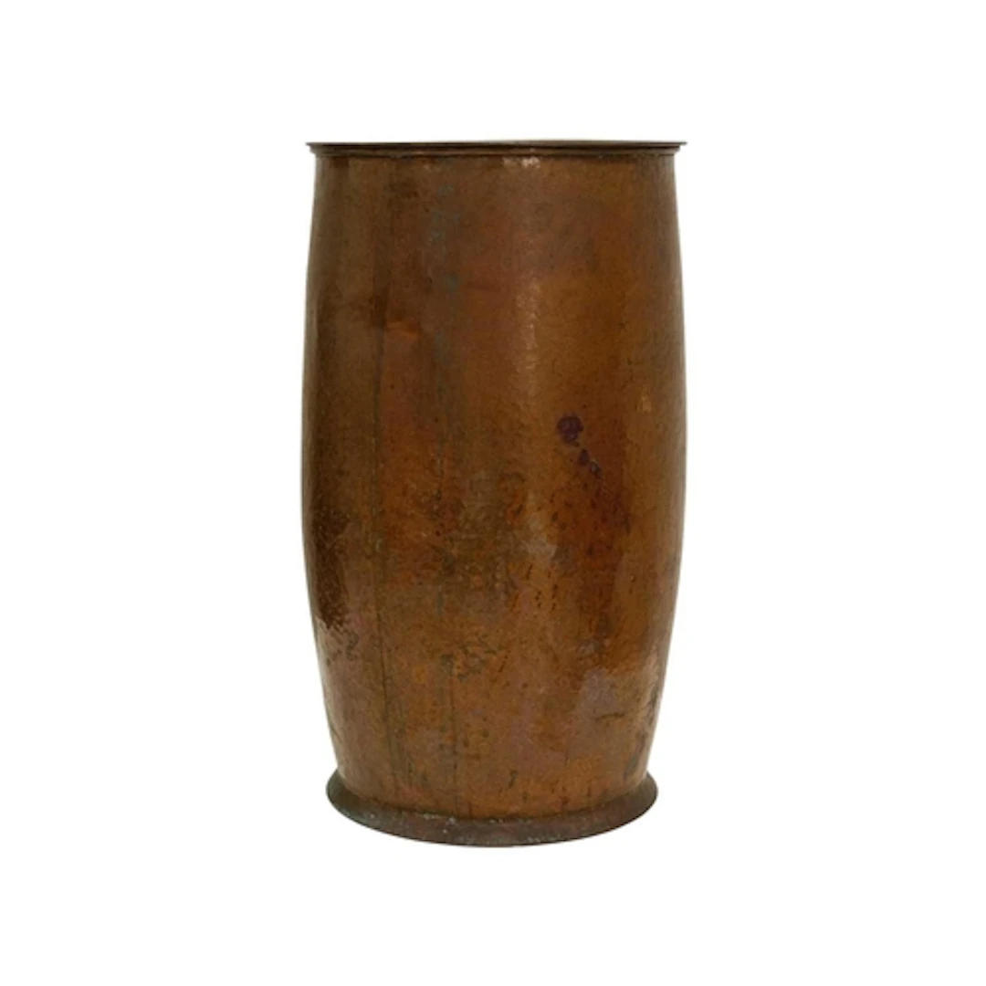 A planished copper coal scuttle of tall cylindrical form. Wi...