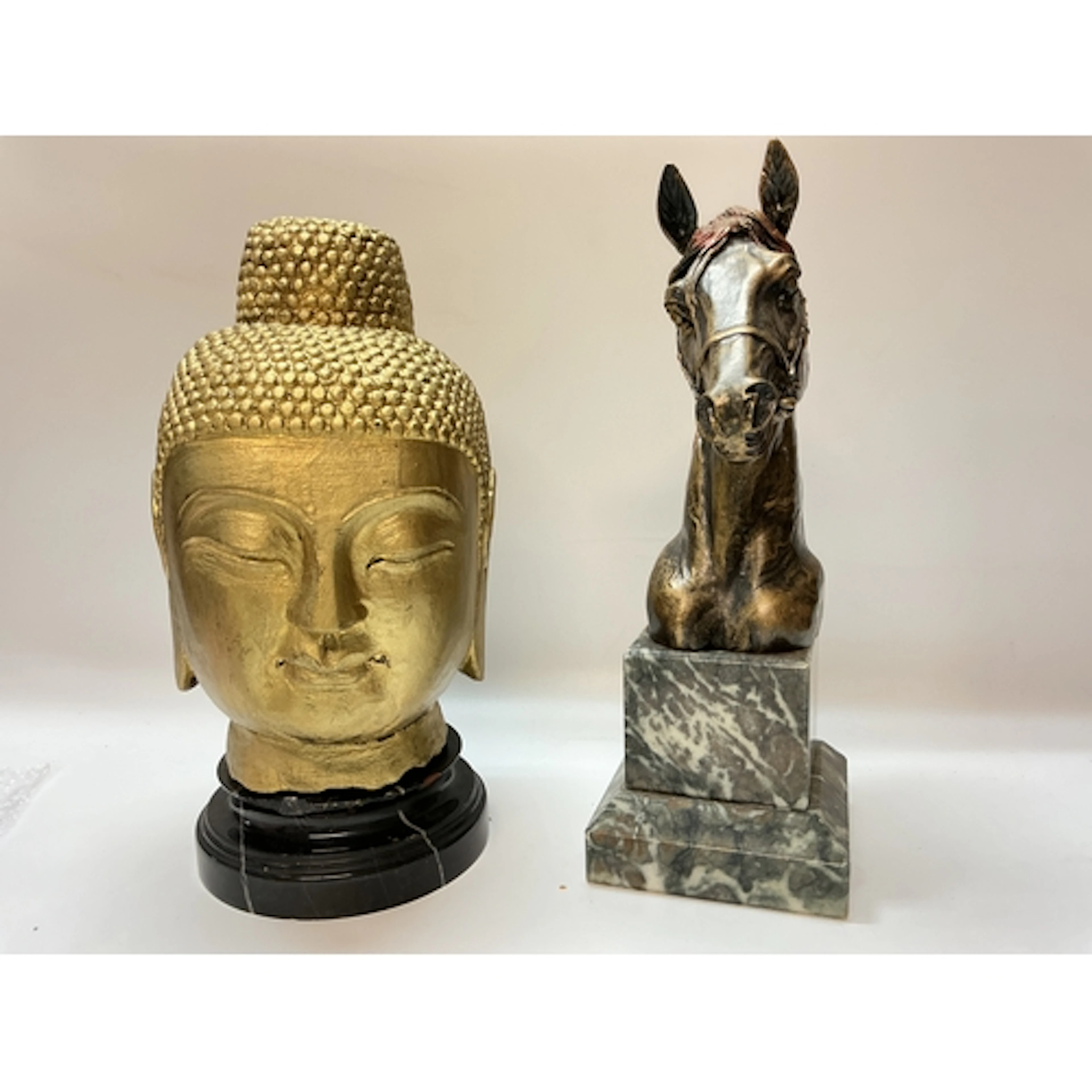 A Buddha head bust and a horse bust 32cm tall