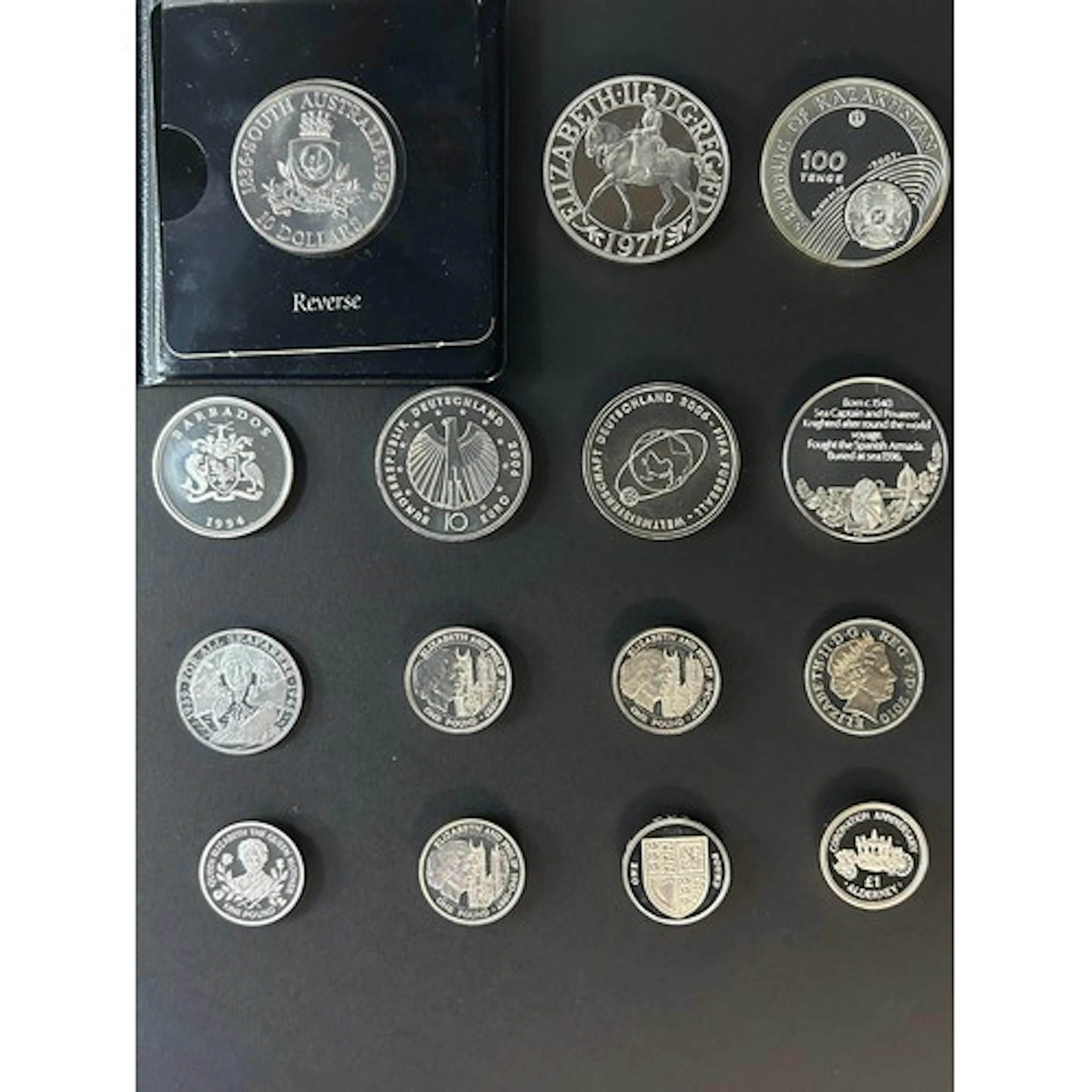A group of 15 World silver commemorative coins, including Au...