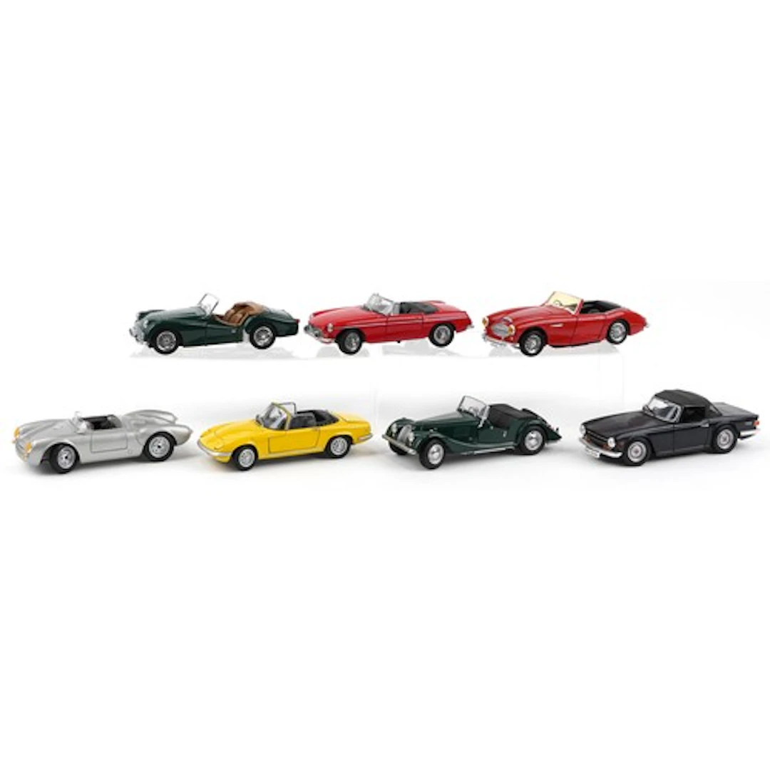 Seven diecast model vehicles including 1974 Triumph TR6, Por...