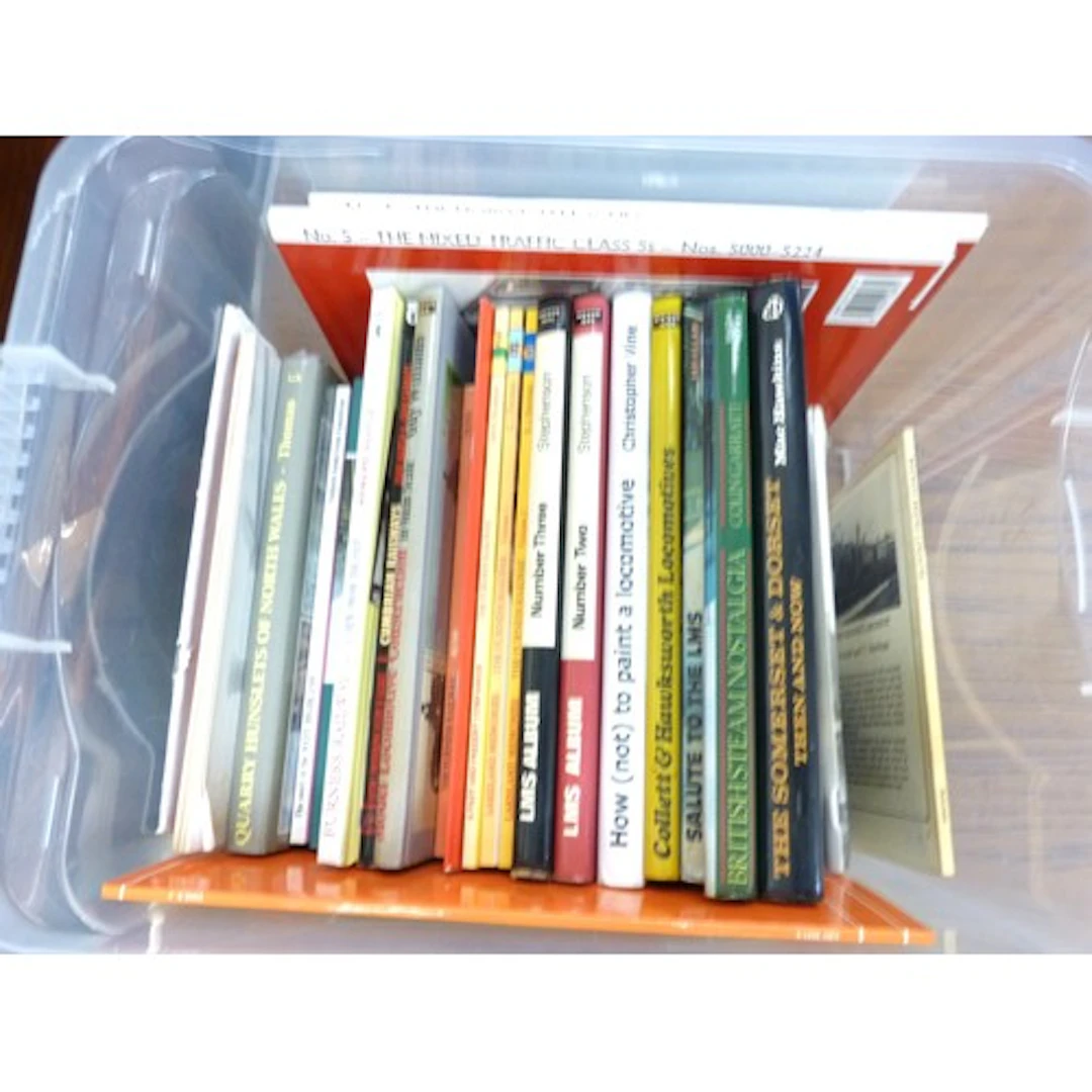 Two boxes of vintage steam locomotive books.