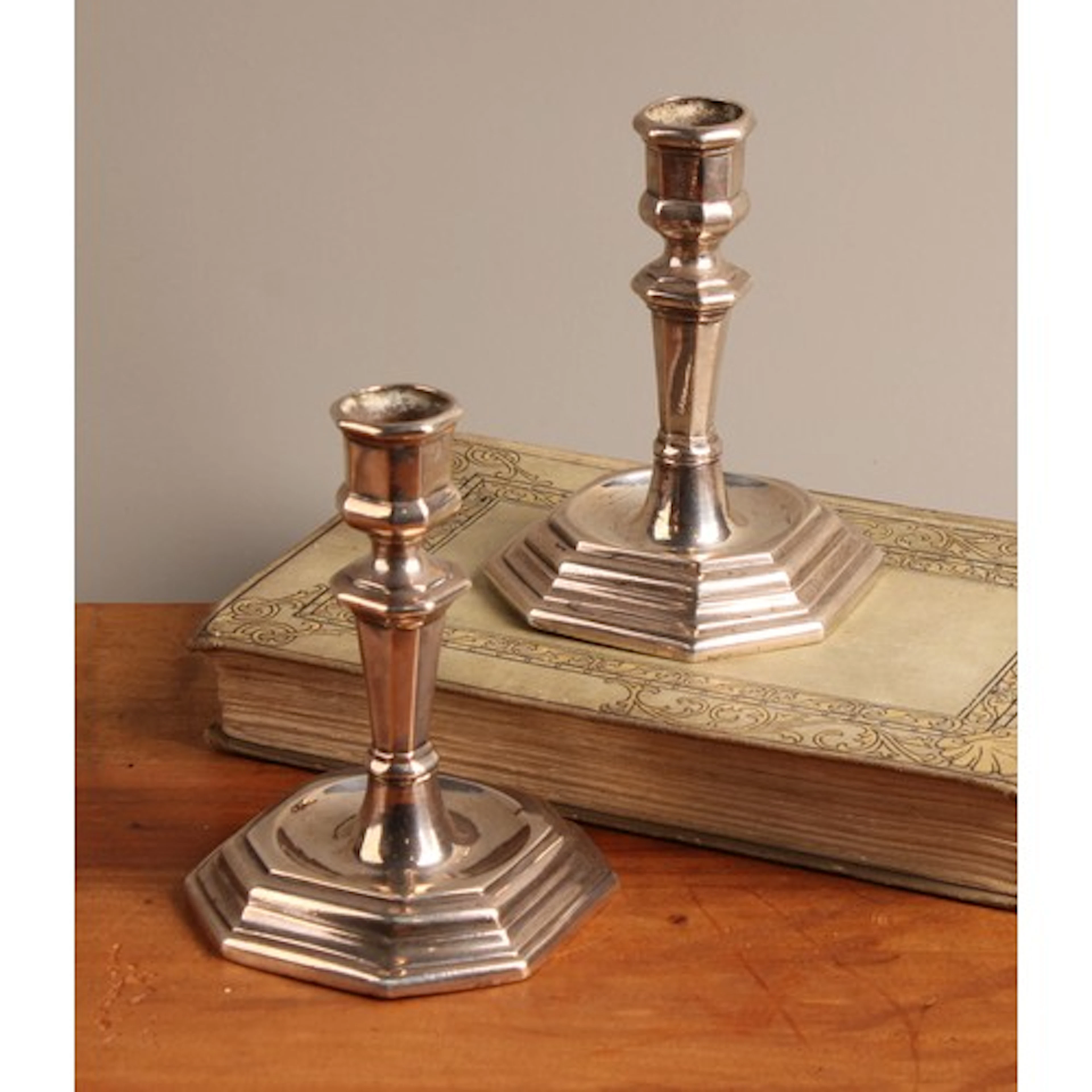 A pair of 18th century Italian silver canted square candlest...