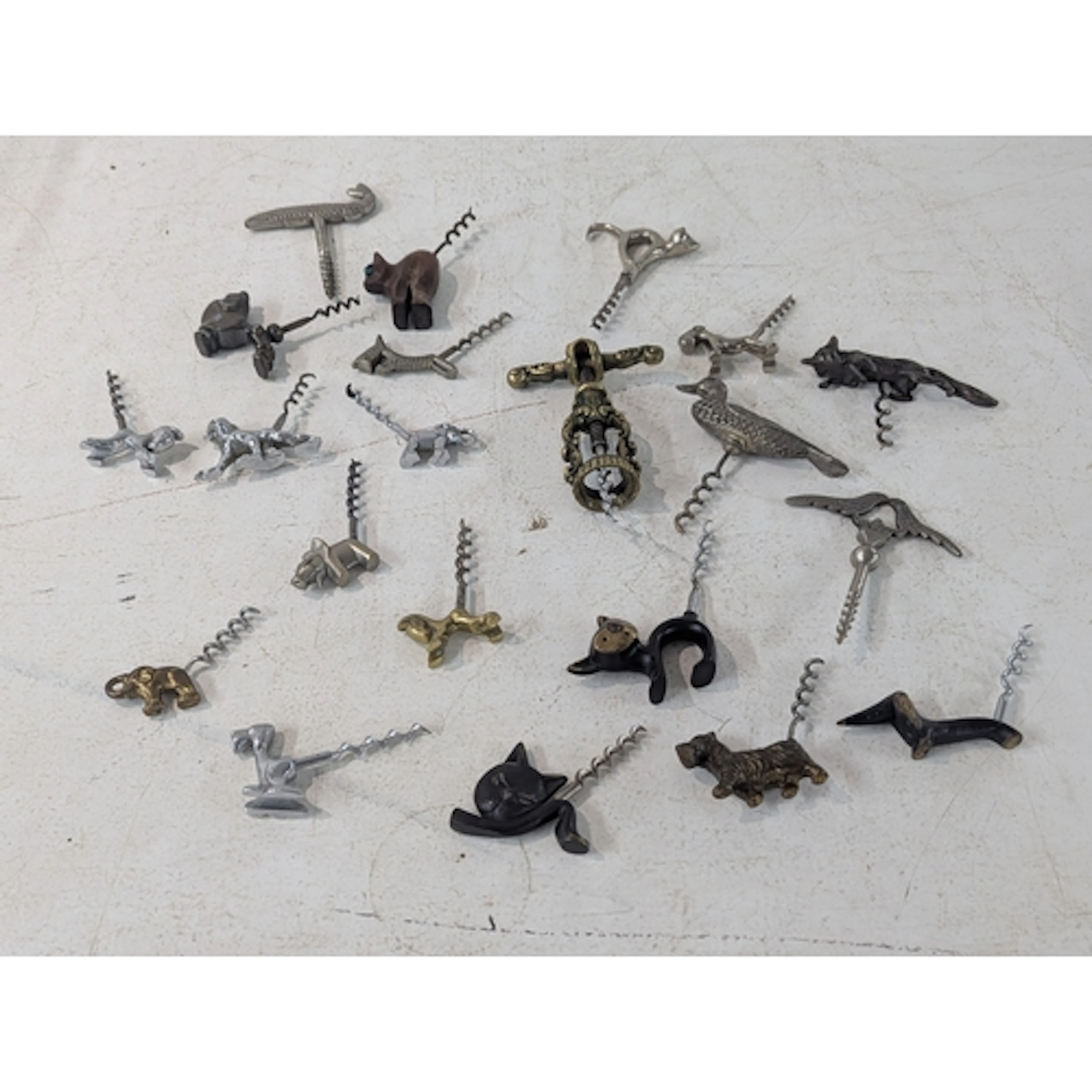 A collection of vintage corkscrews fashioned as animals to i...
