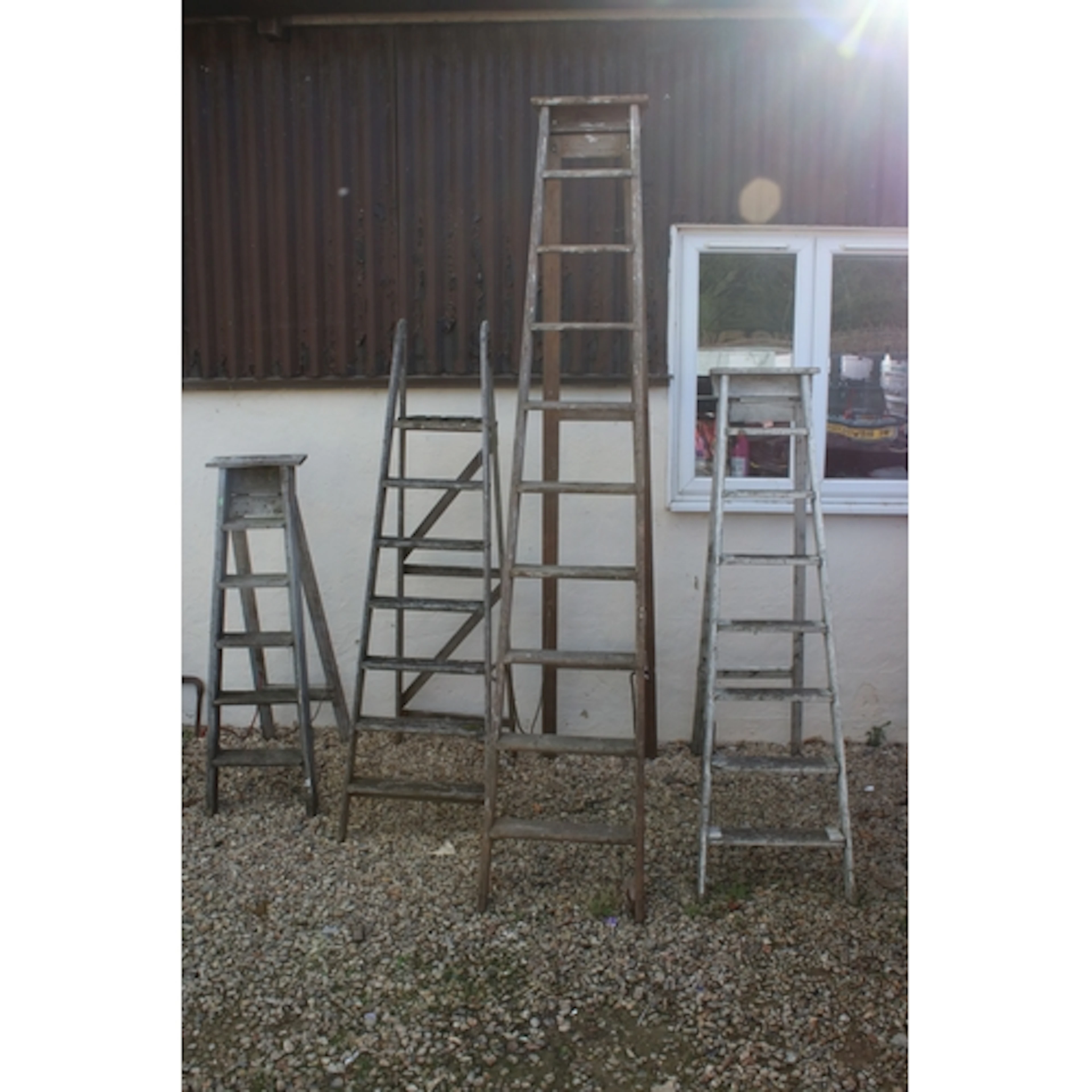 Group of four wooden step ladders, to include a The Titan La...