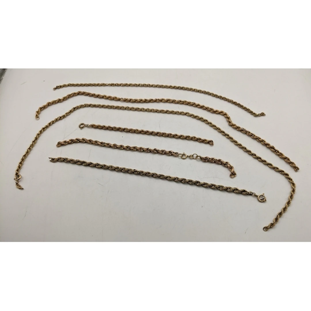 A group of six 9ct yellow gold rope twist chain necklaces an...