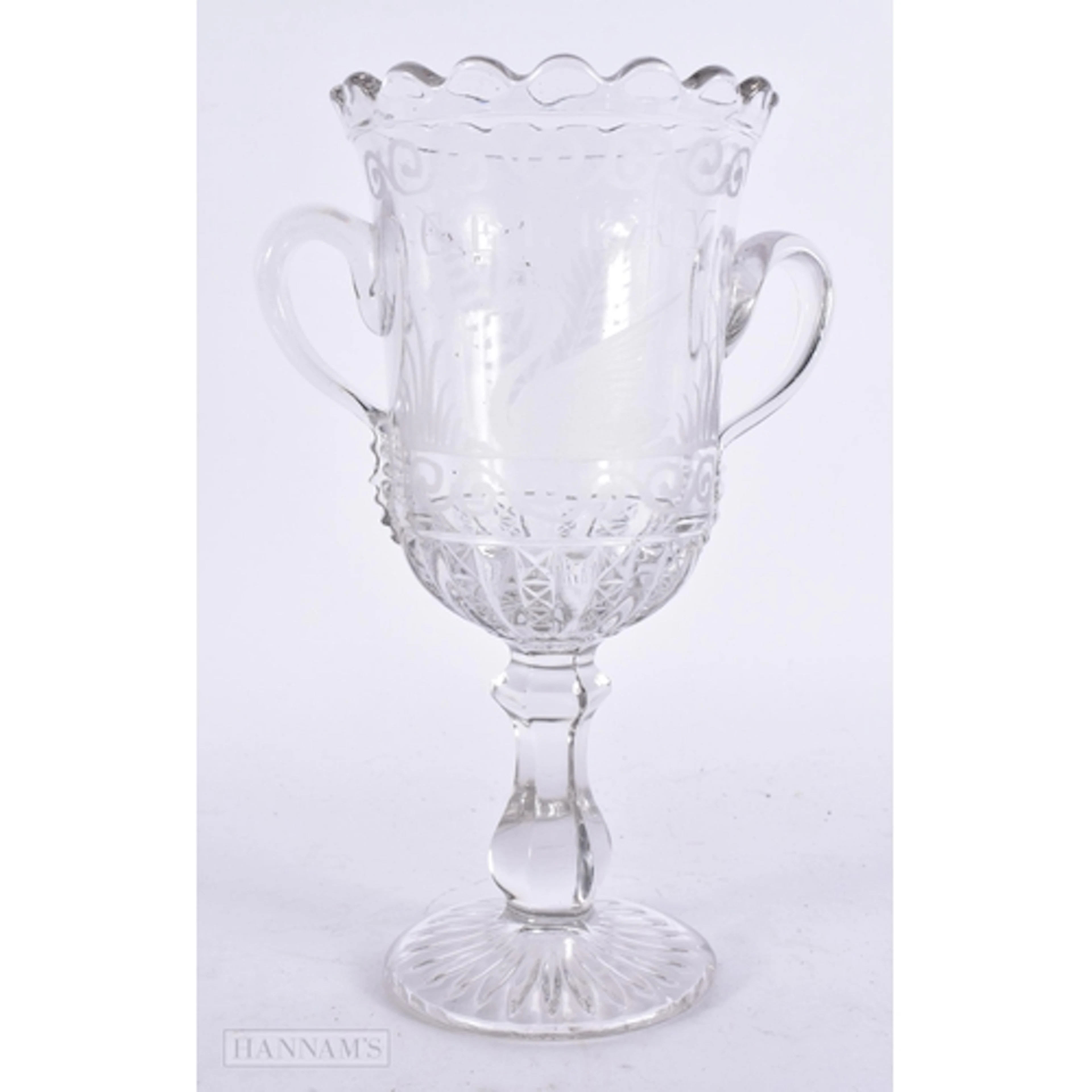 A LARGE ANTIQUE TWIN HANDLED CELERY VASE engraved with a swa...