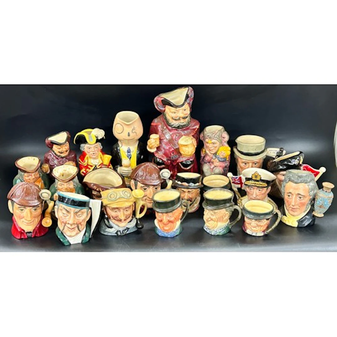 A collection of mostly Royal Doulton character Toby Jugs, an...