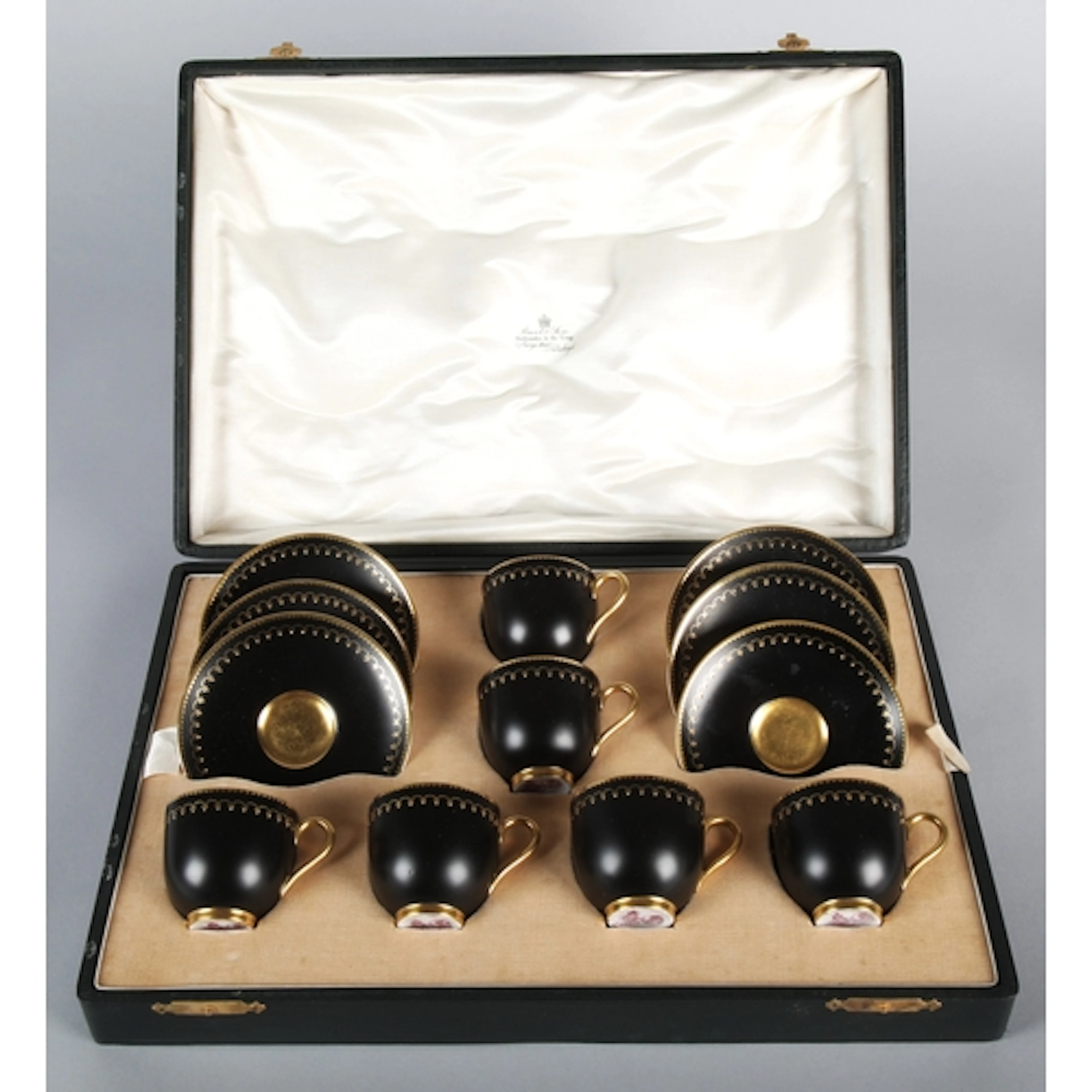 Royal Worcester black and gilt hand-painted coffee set, case...