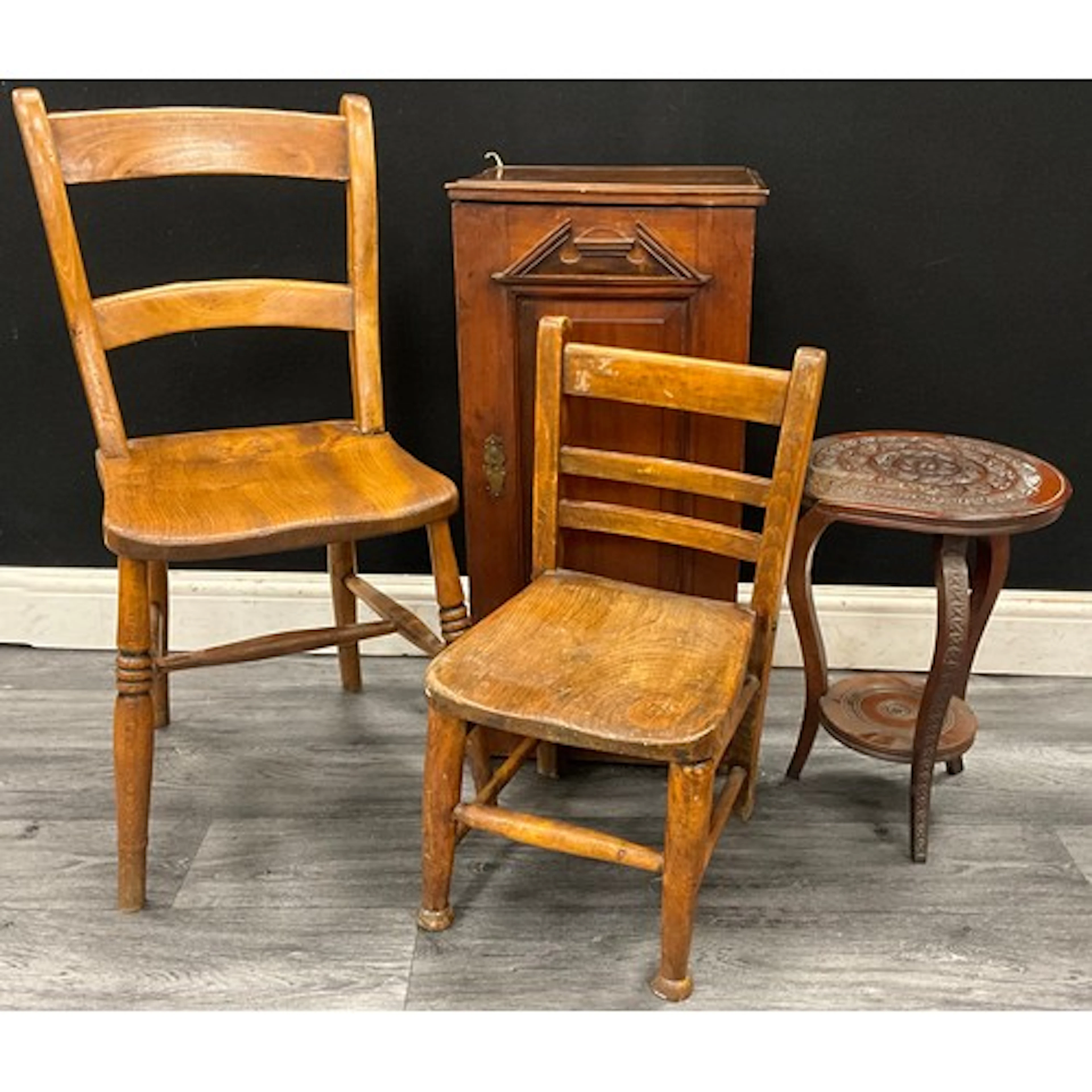 An antique Japanese carved occasional table, possibly retail...