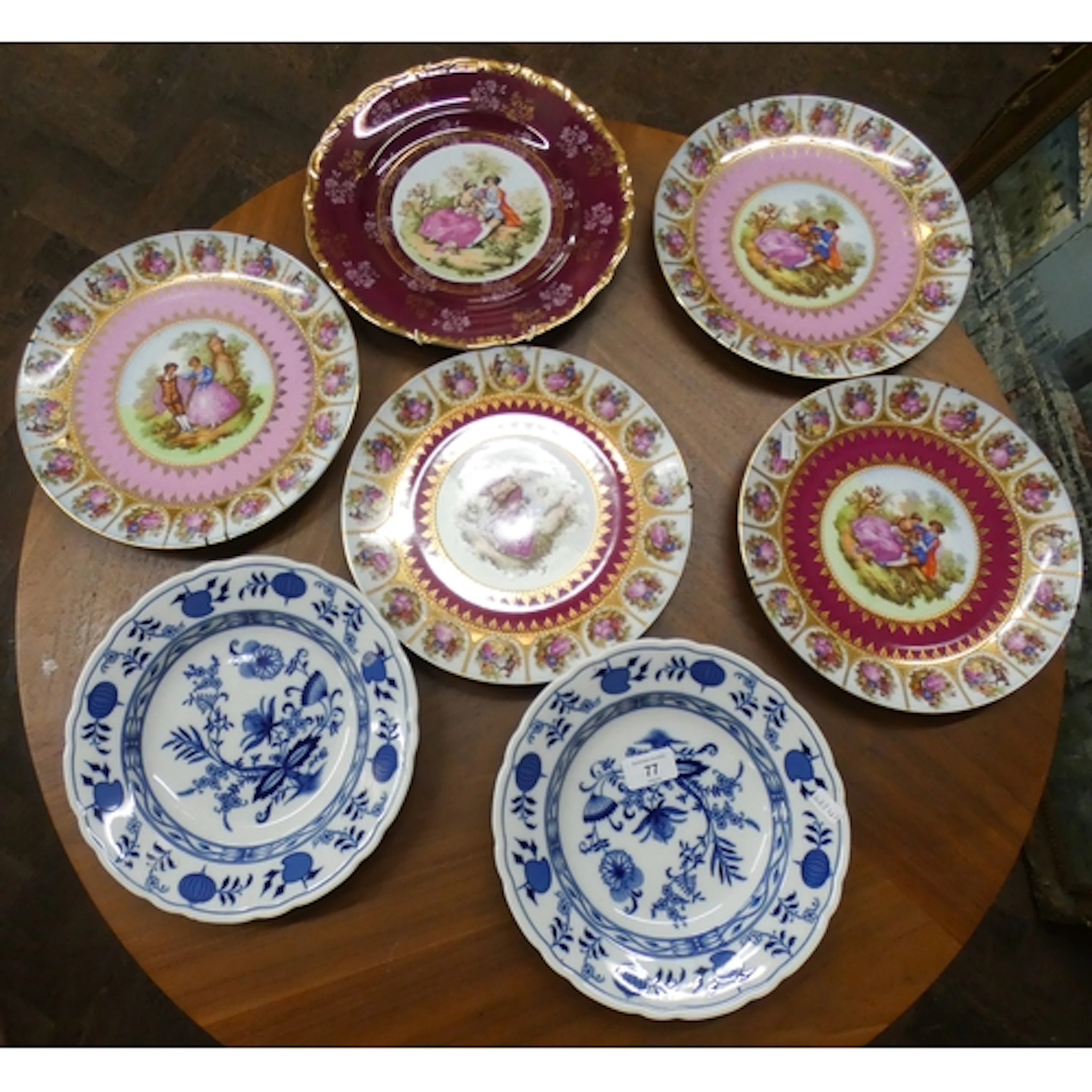 Five Bavarian porcelain gilt edged decorative wall plates an...