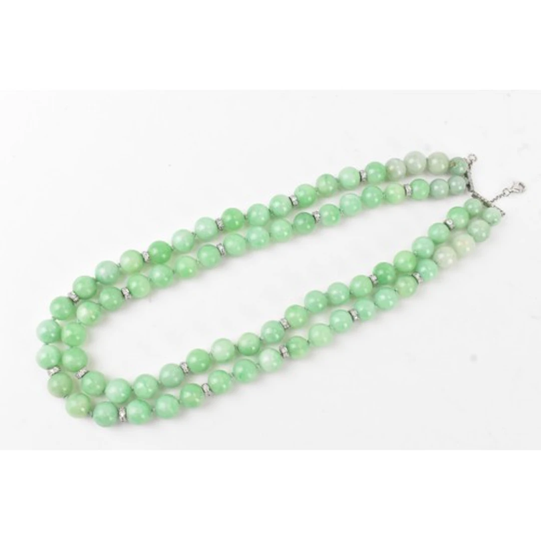 A Chinese jade beaded necklace, consisting of approximately ...
