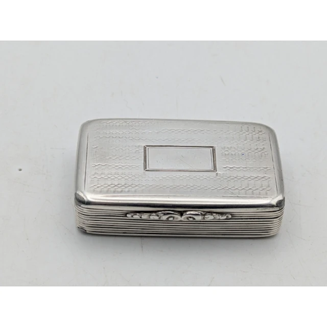 A William IV silver snuff box having engraved decoration, wi...