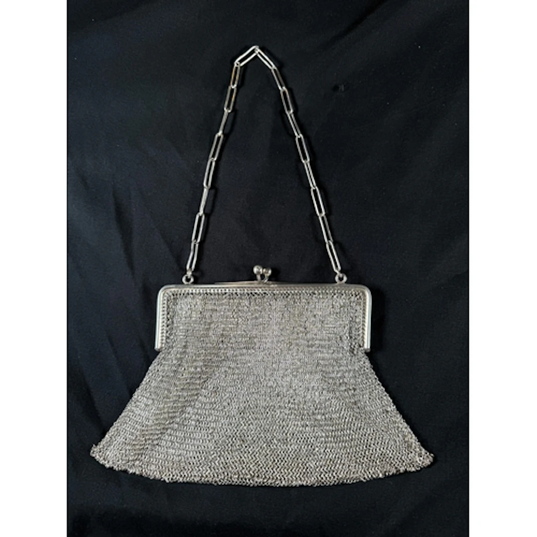 A hallmarked silver mesh chain mail evening purse, with chai...