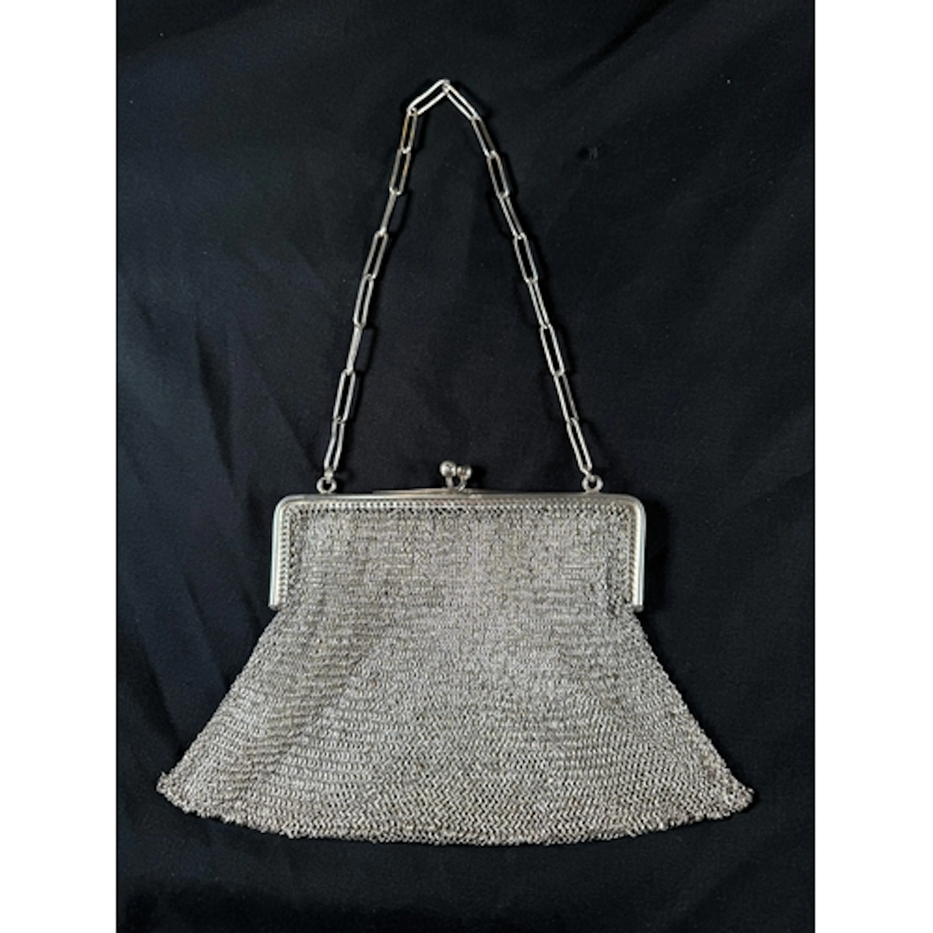 A hallmarked silver mesh chain mail evening purse, with chai...