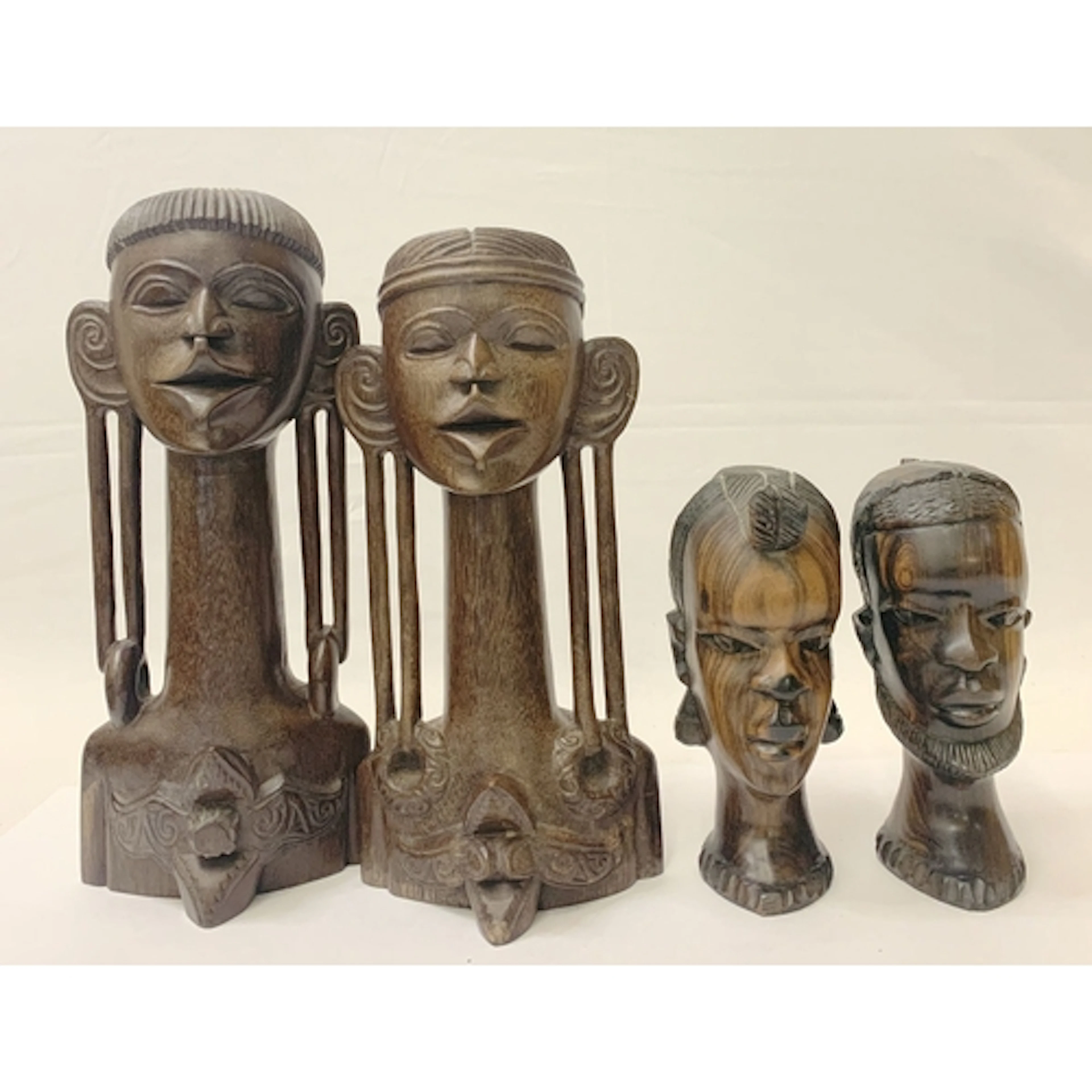 2 Pairs Carved Wooden Sculptures, Sarawak in styling, elonga...