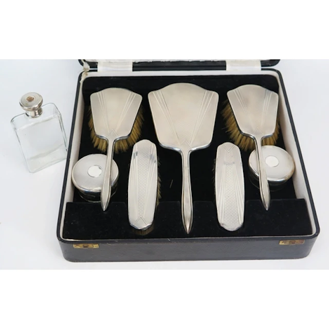 An Art Deco period silver dressing table set, maker W G Soth...