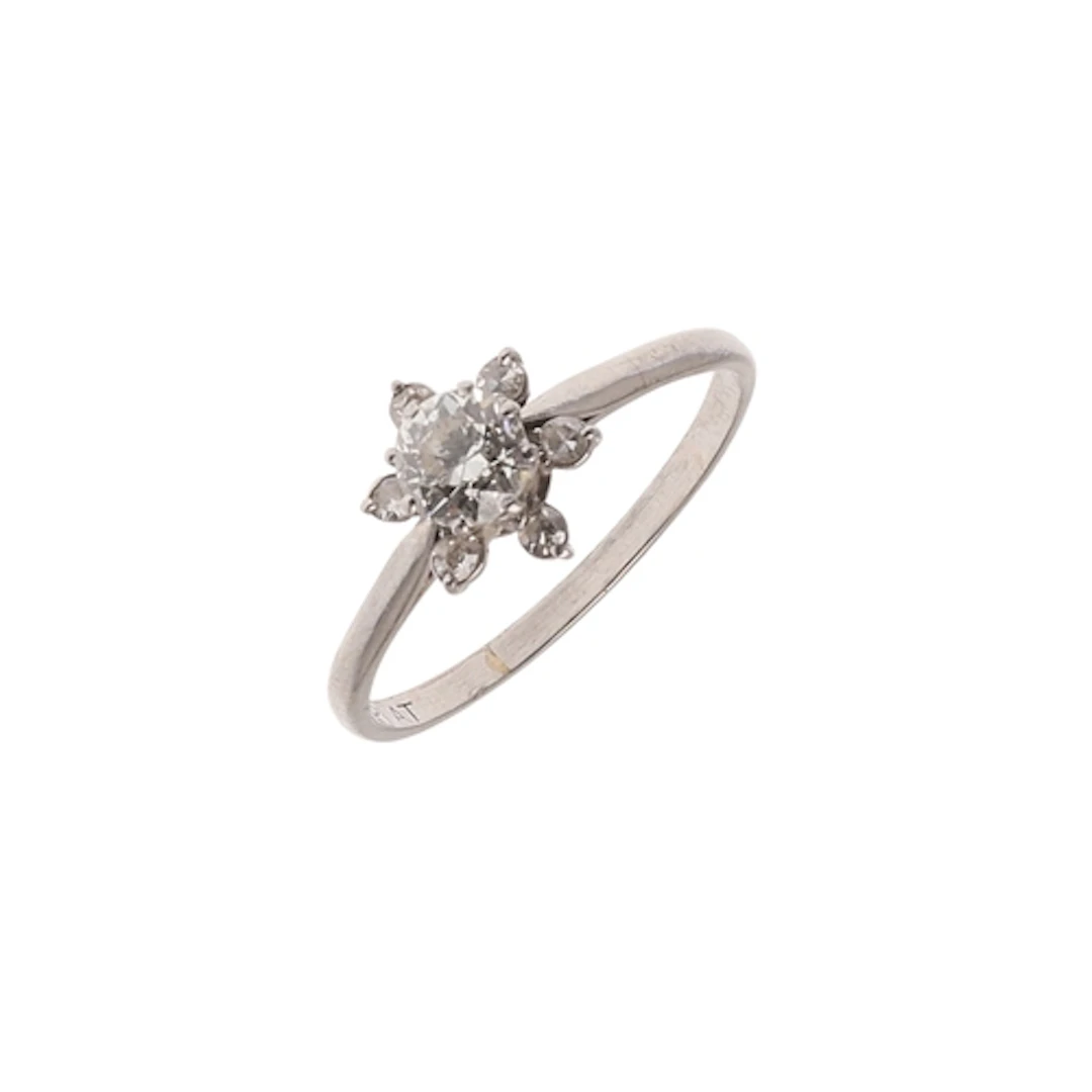 A DIAMOND SOLITAIRE RING. the circular-cut diamond is set wi...
