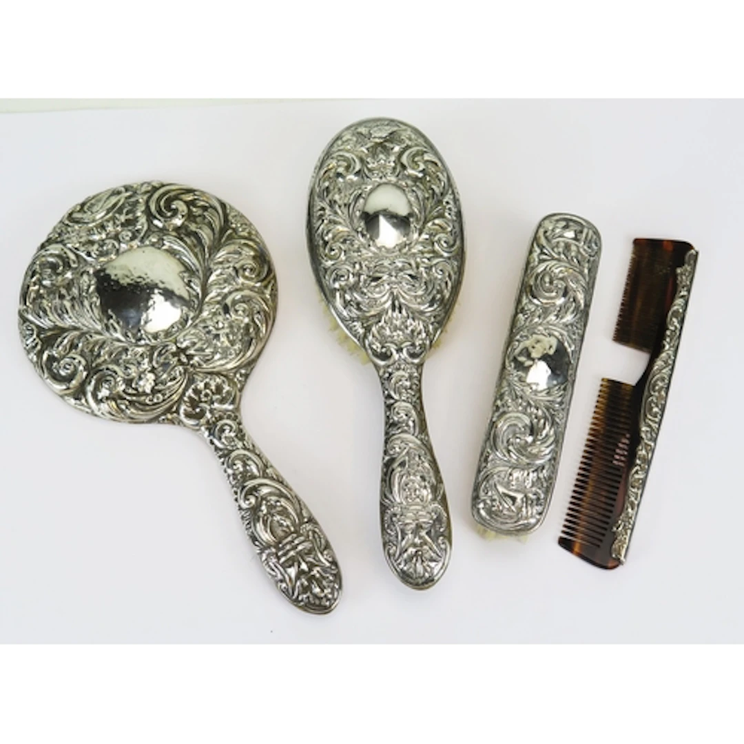 An Elizabeth II silver backed dressing table set, maker W I ...
