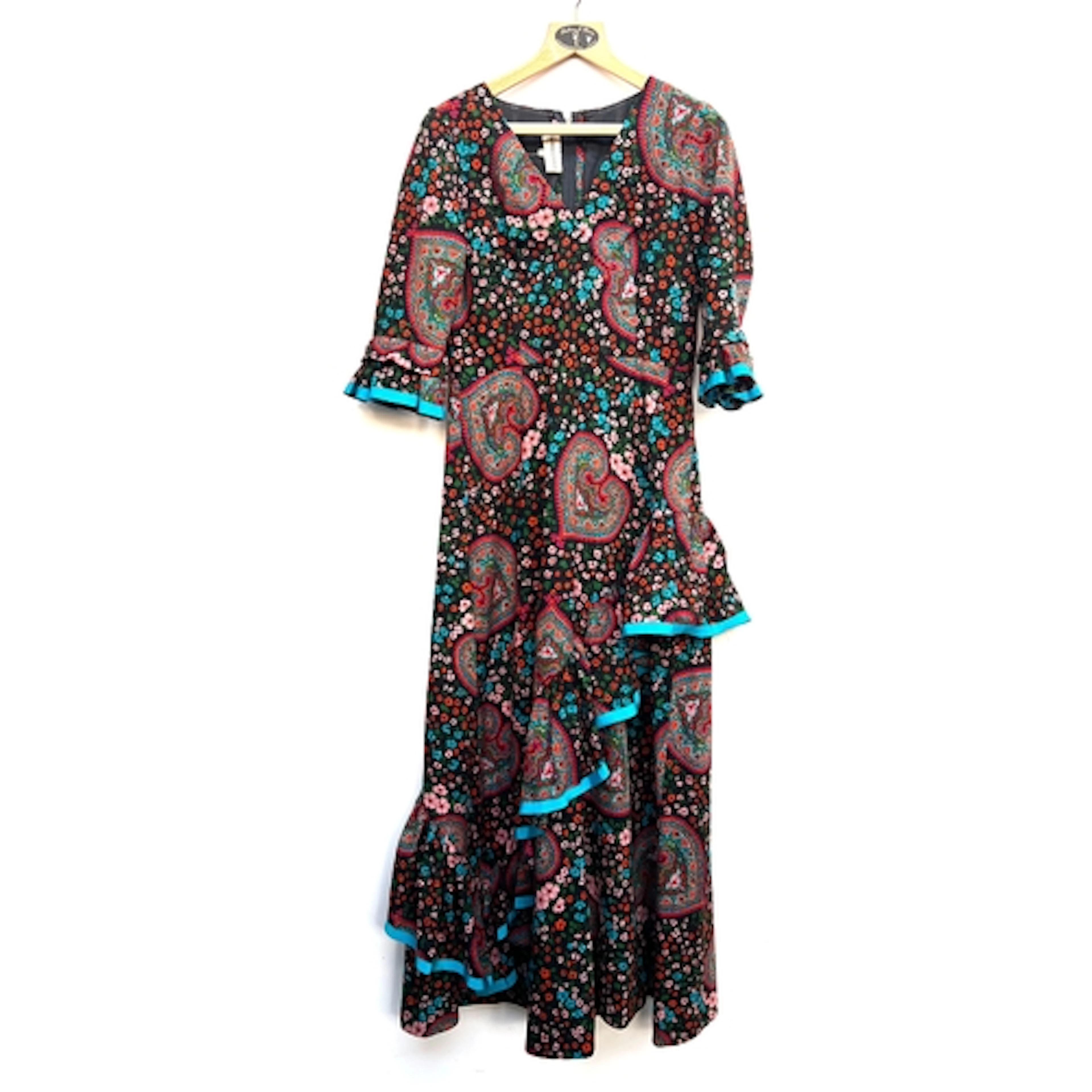 A Troubadour long sleeved maxi dress in a floral print on a ...