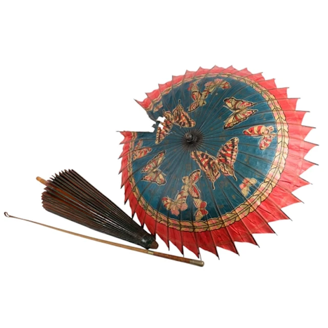 Two Chinese parasols and a Regimental riding crop