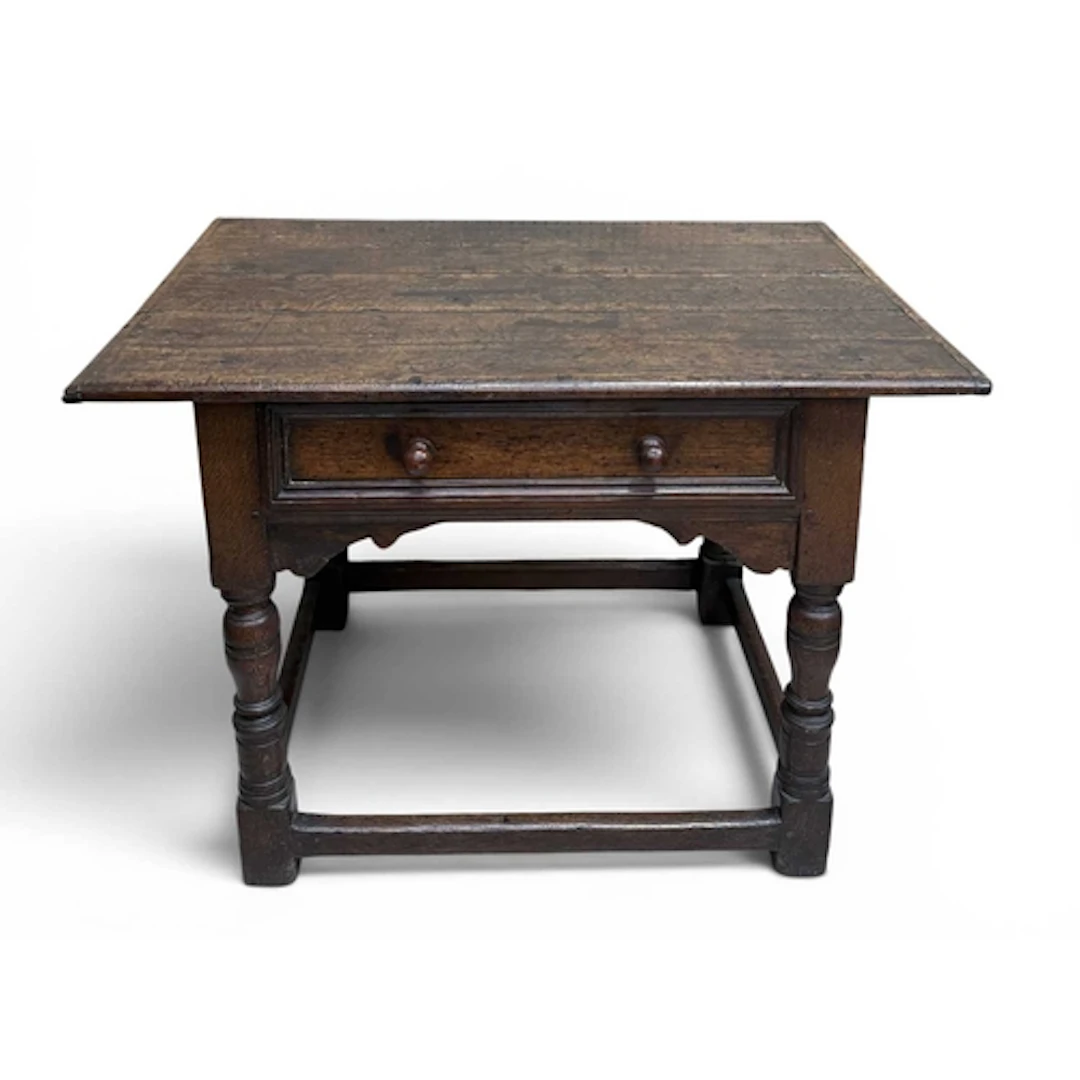 A LATE 17TH CENTURY OAK SIDE TABLE The rectangular top above...