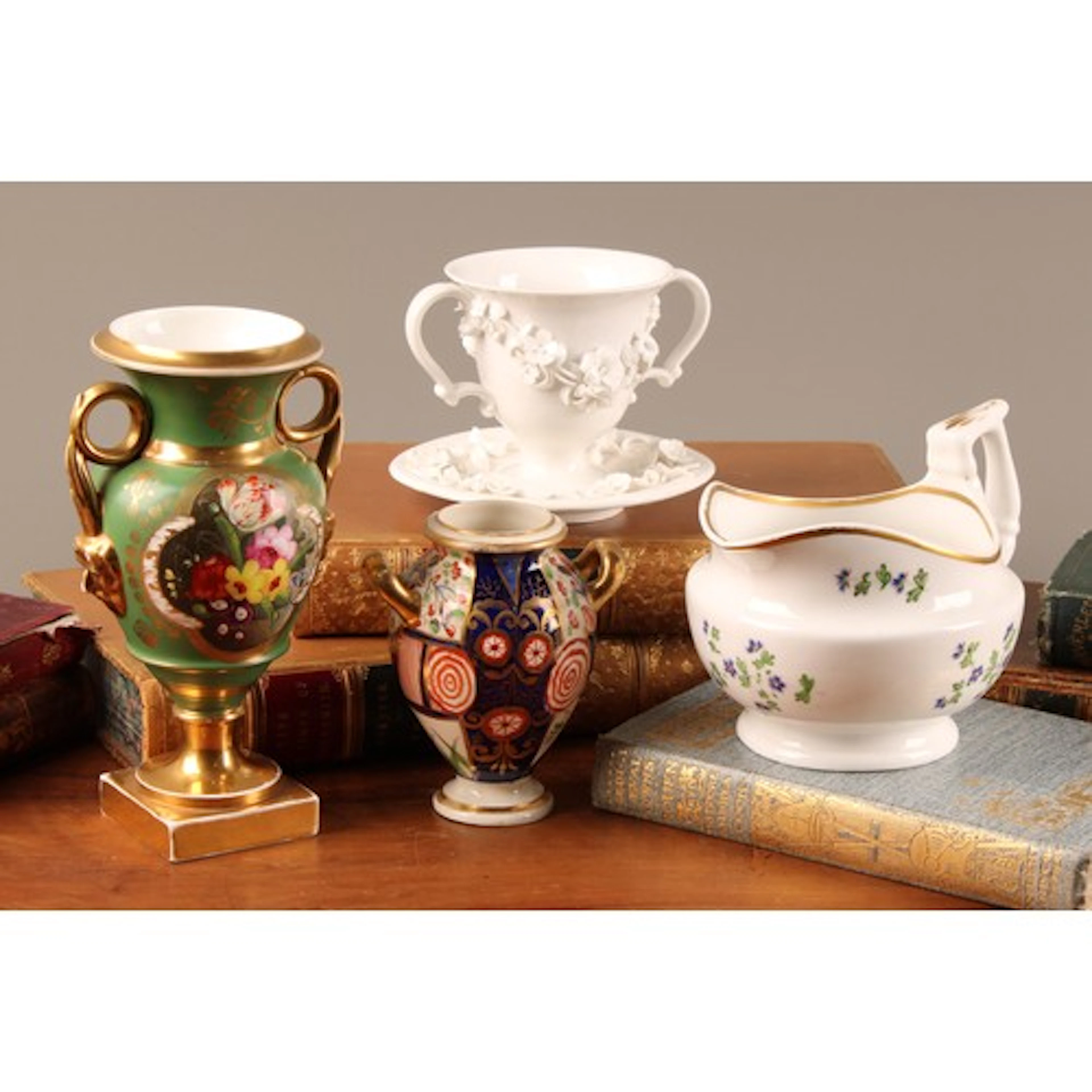 A Derby porcelain two-handled pedestal vase, painted with co...
