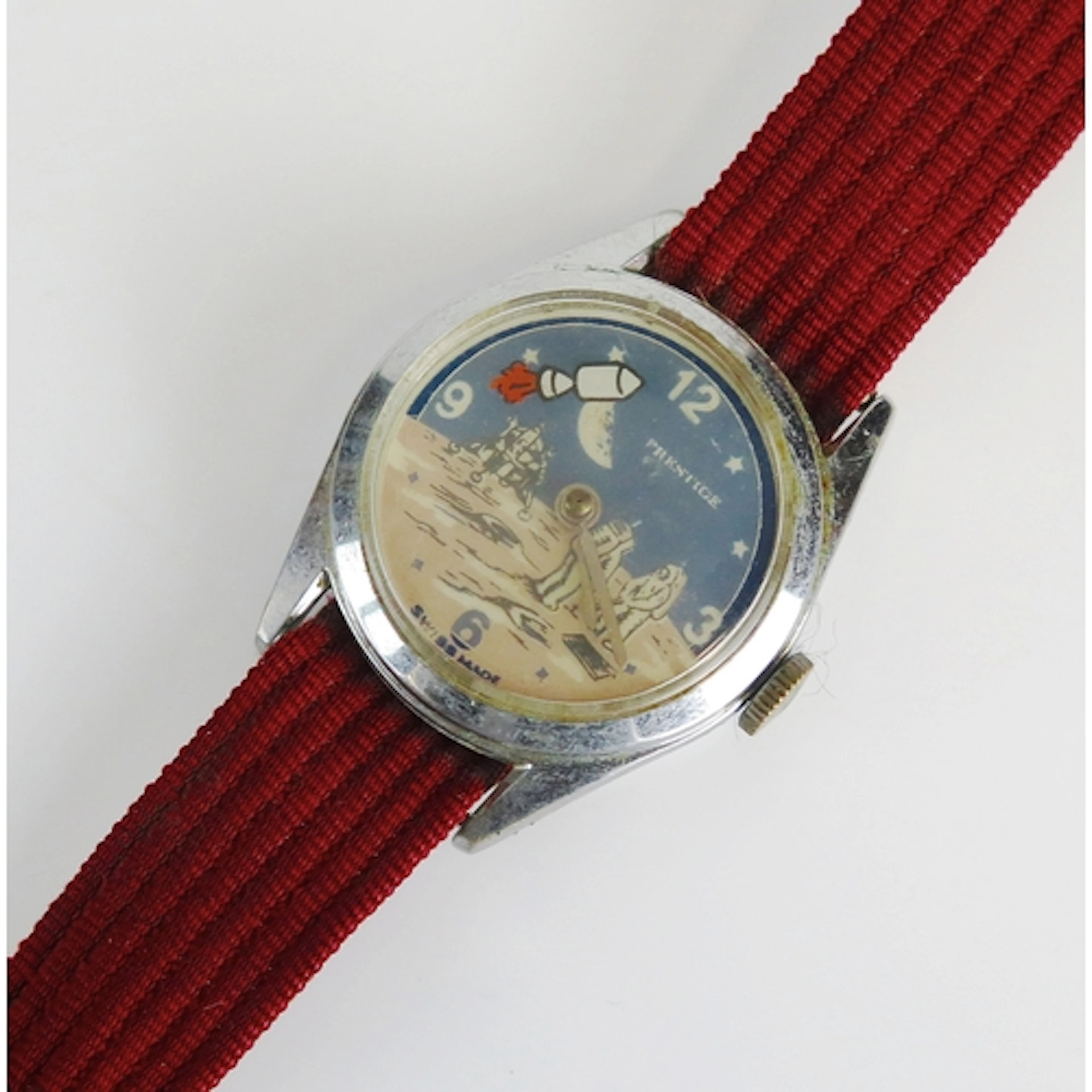 A Prestige novelty moon landing watch, 30mm case. Winds and ...